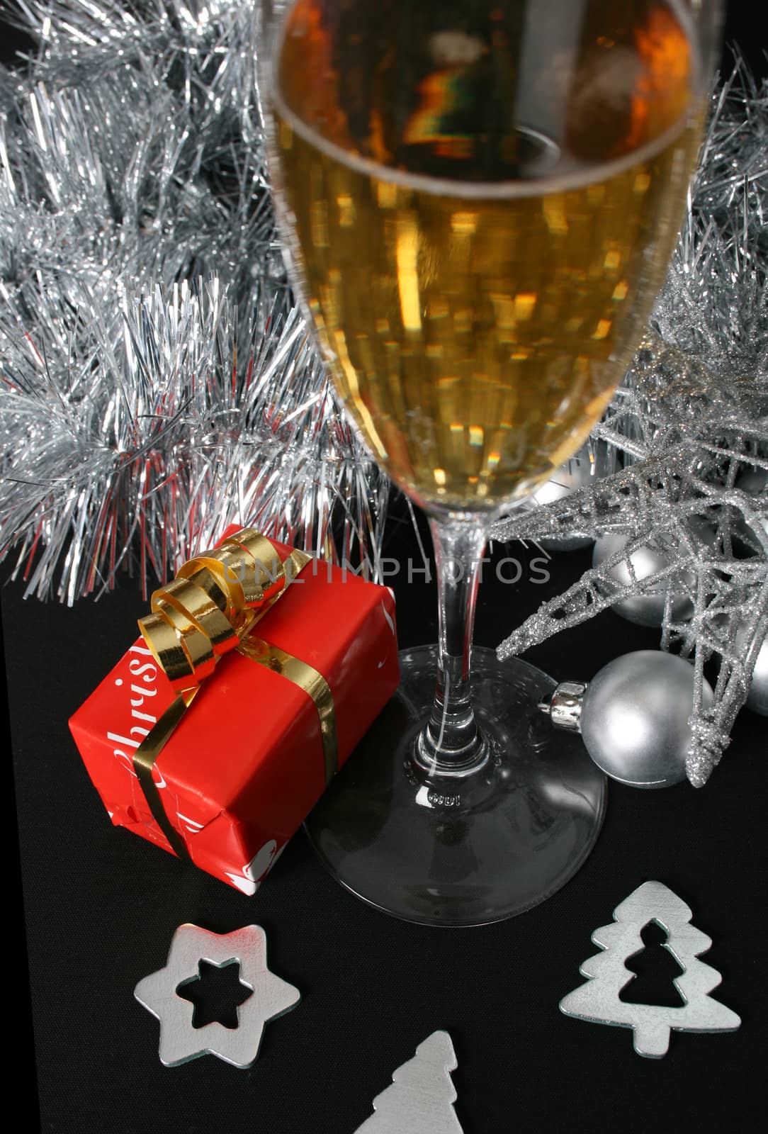 Small christmas gift amongst a variety of decorations