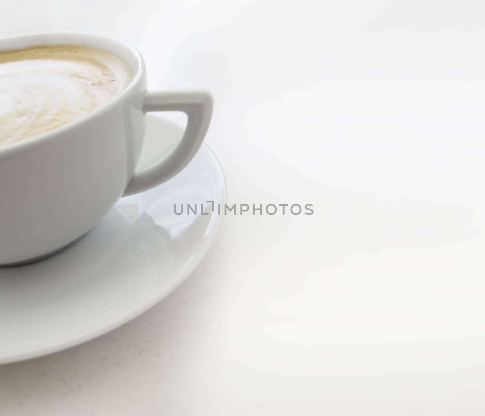 Cup of coffee on a white table