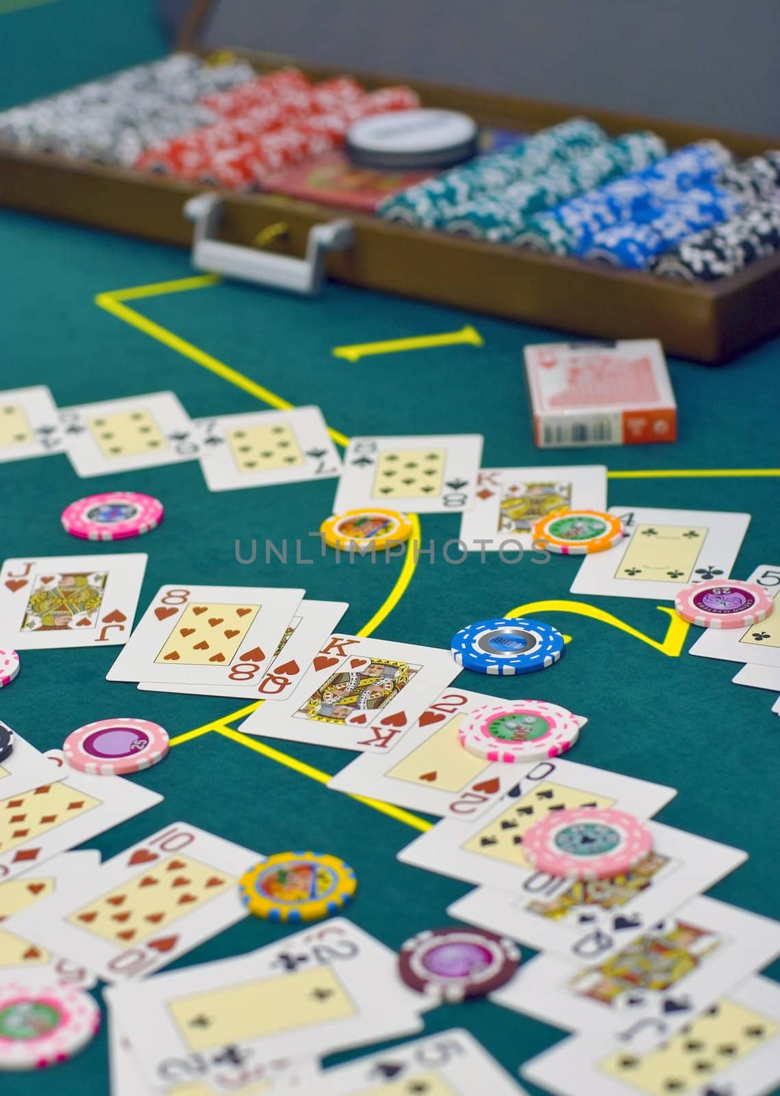 table with chips and card batch in casino