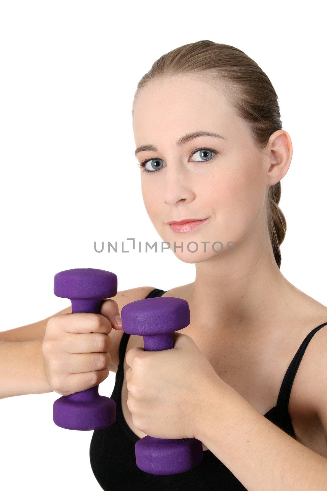 Young blonde exercising with light purple weights