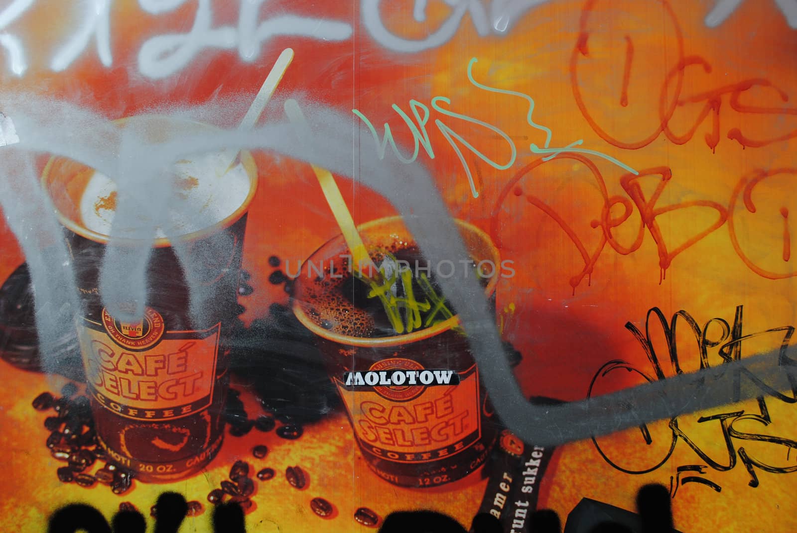 An advertisement covered in graffiti.
