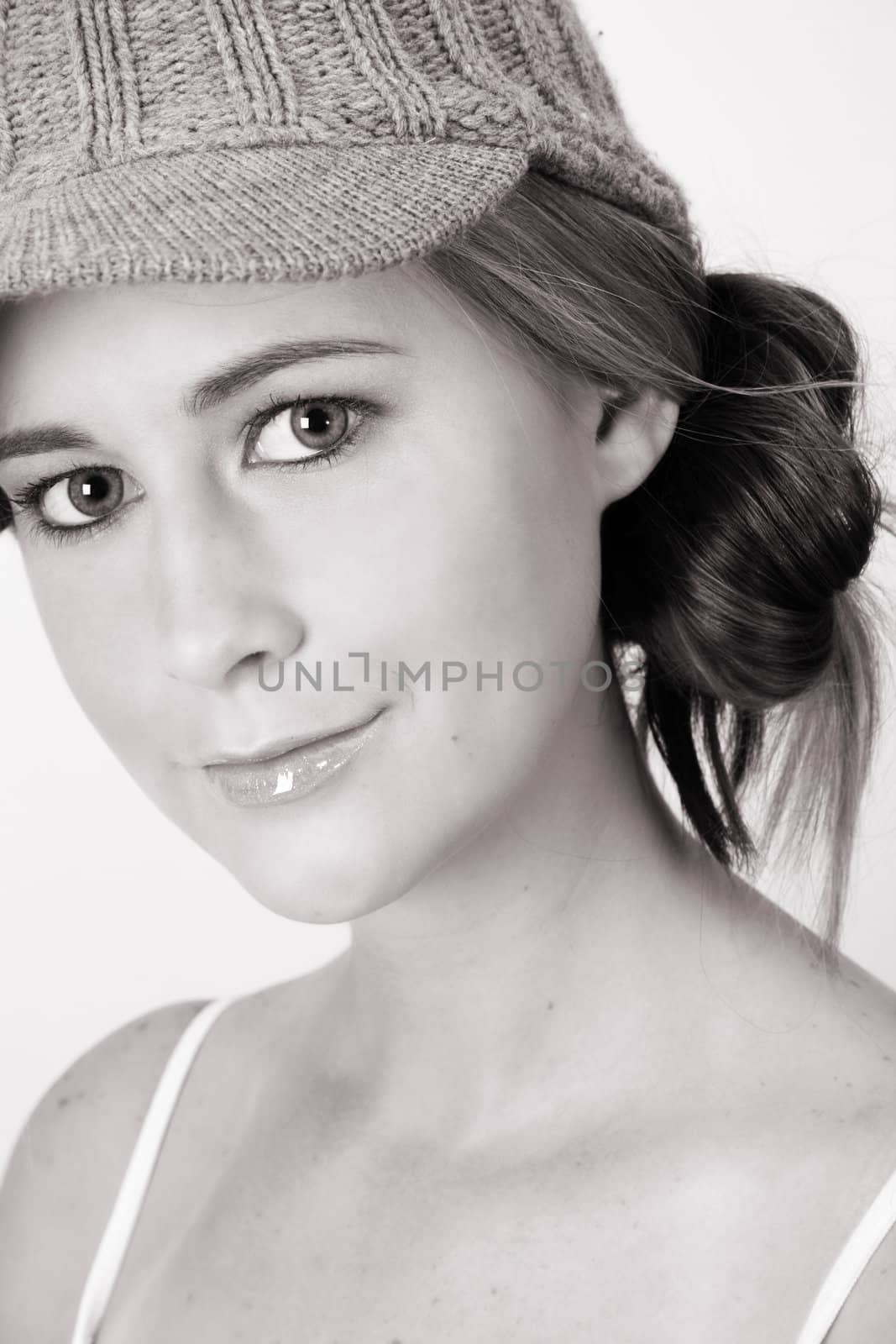 Beautiful young female model wearing a grey hat
