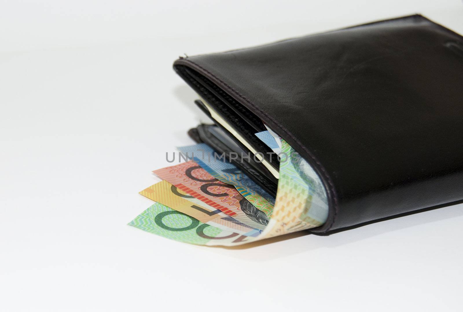 Collection of Australian fifty dollar currency notes in a black male wallet