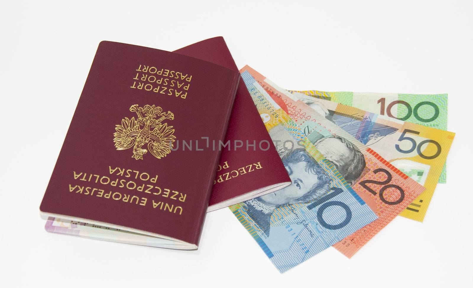 red passport, Australian money, isolated on white. by wojciechkozlowski