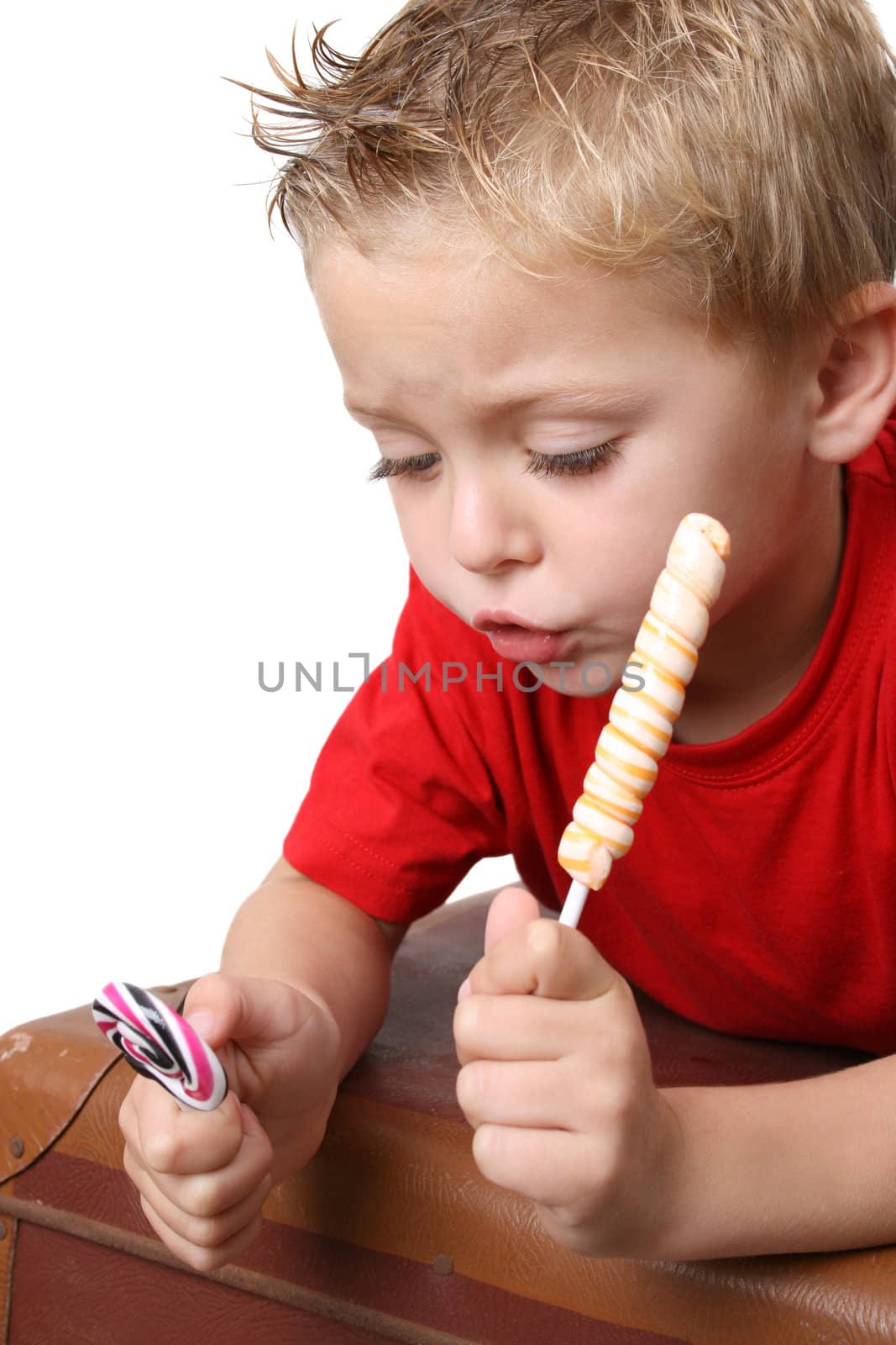 Beautiful blond toddler on a white background