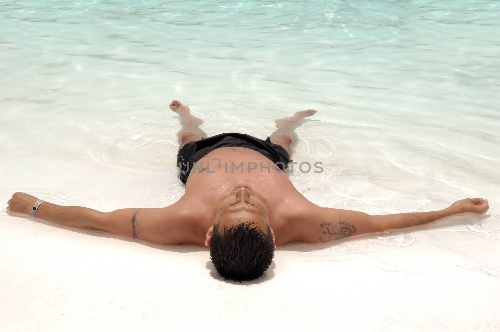 A man is relaxing in swimming pool