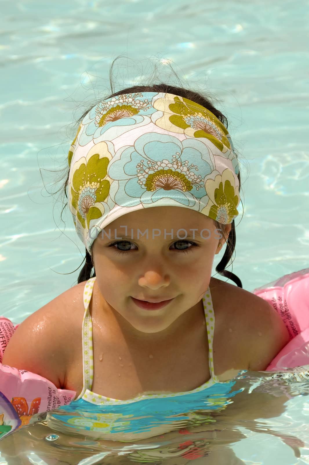 Happy child in a swimming pool