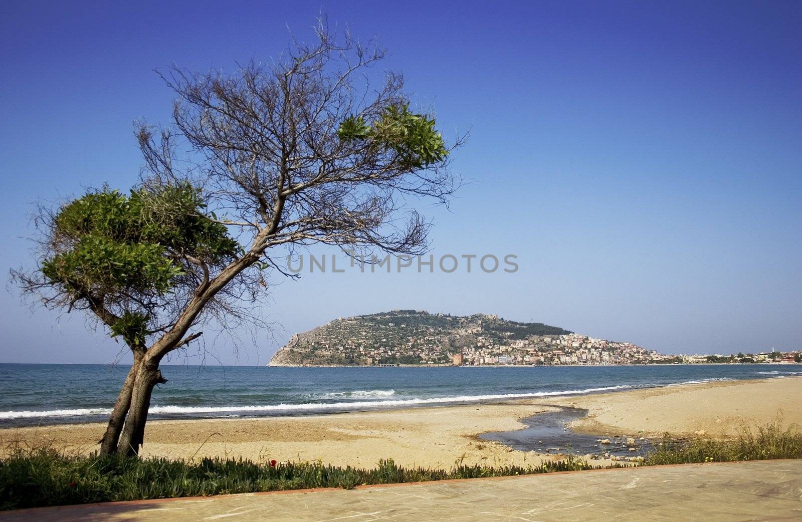 Alanya peninsula view from beach by AlexKhrom