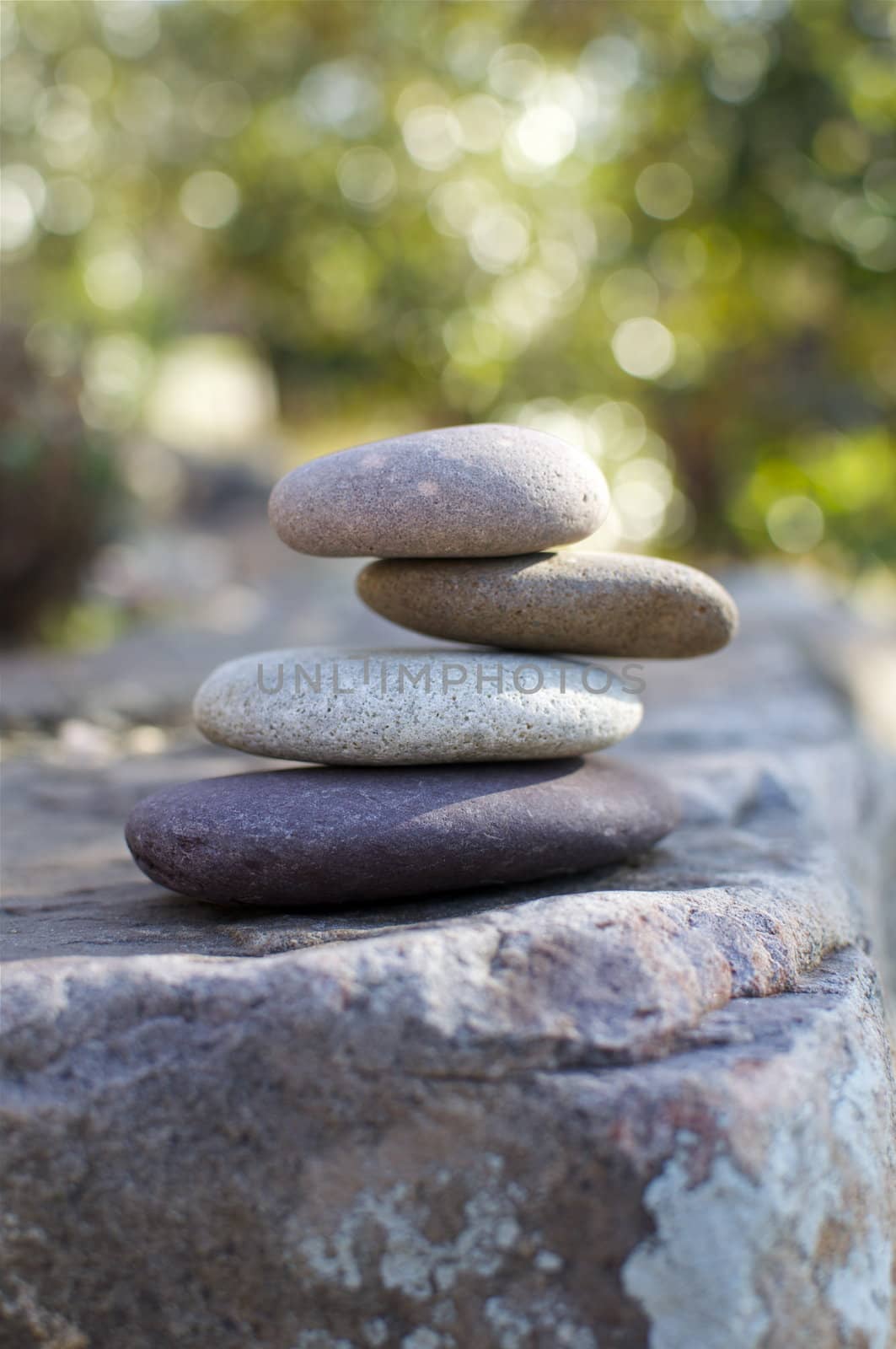 A stack of smooth, round stones evokes a zen feeling.