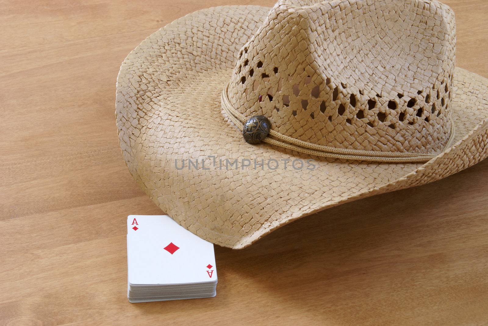 A deck of cards and a hat are holding the table for the comming players.