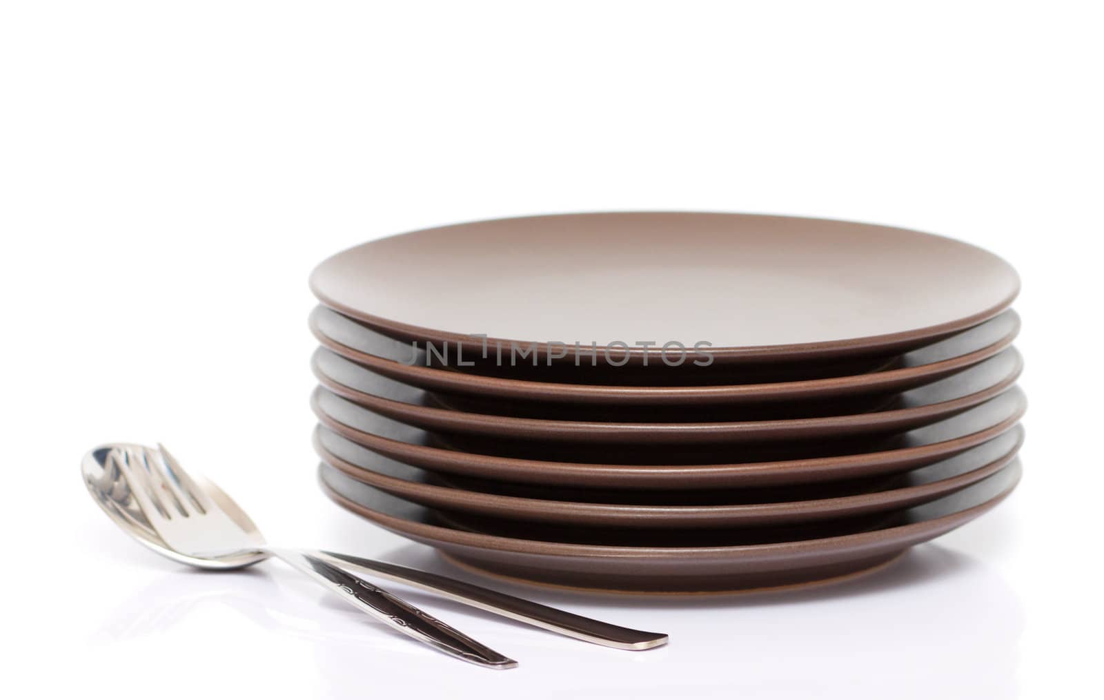A stack of plates with fork and spoon