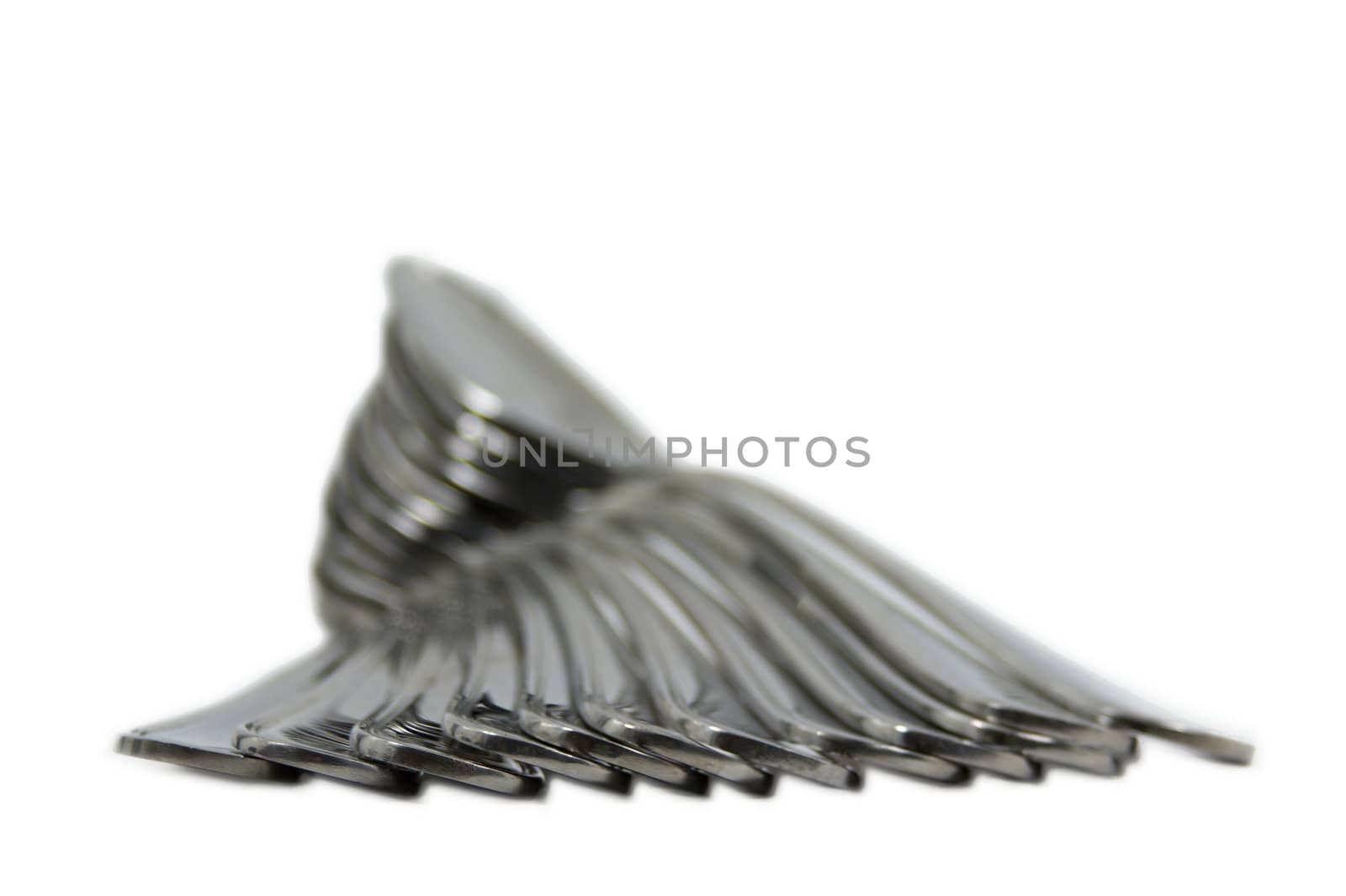 Pile of Spoons facing away isolated by bobkeenan