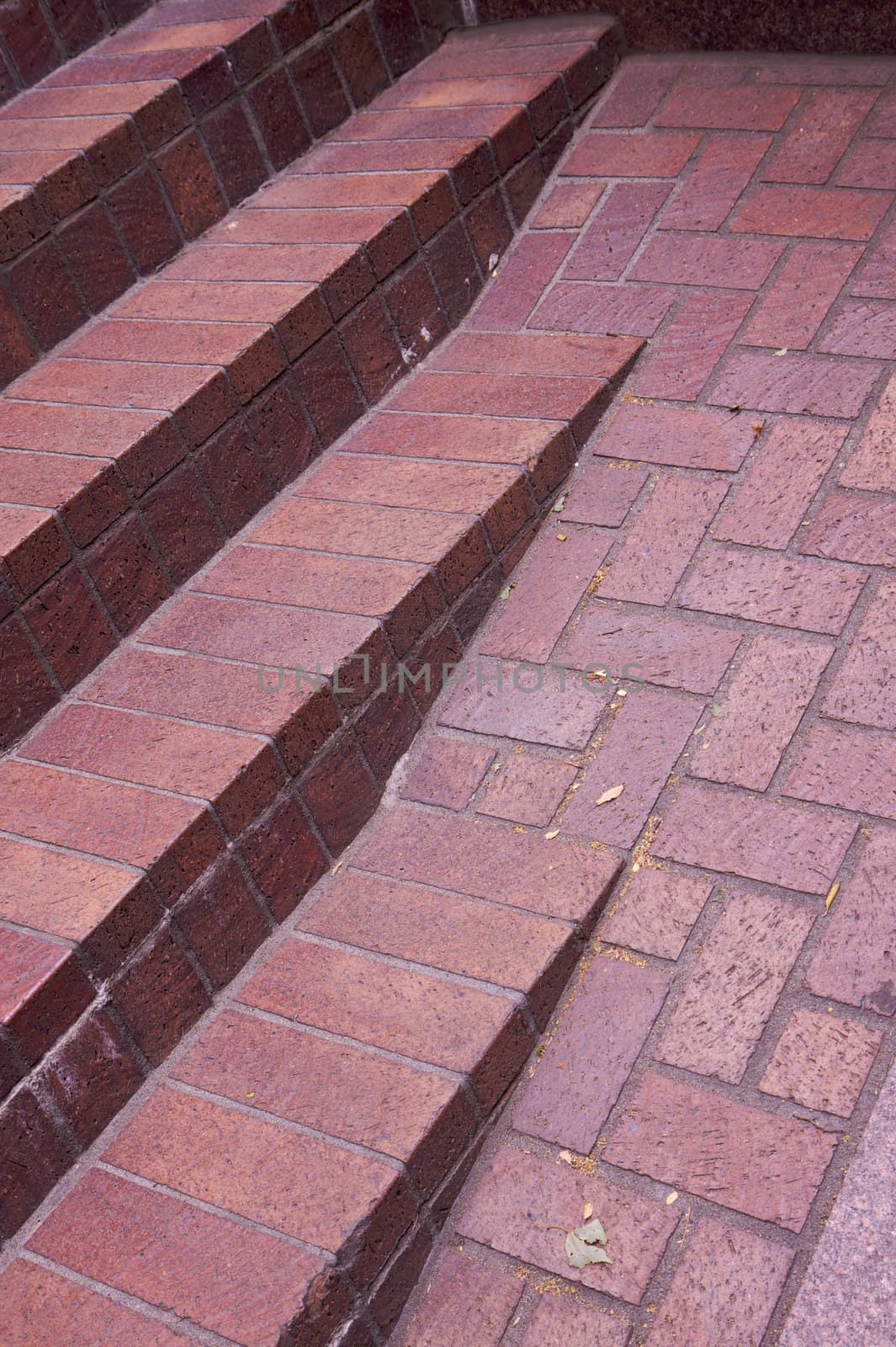 dimishing red brick stair in urban setting