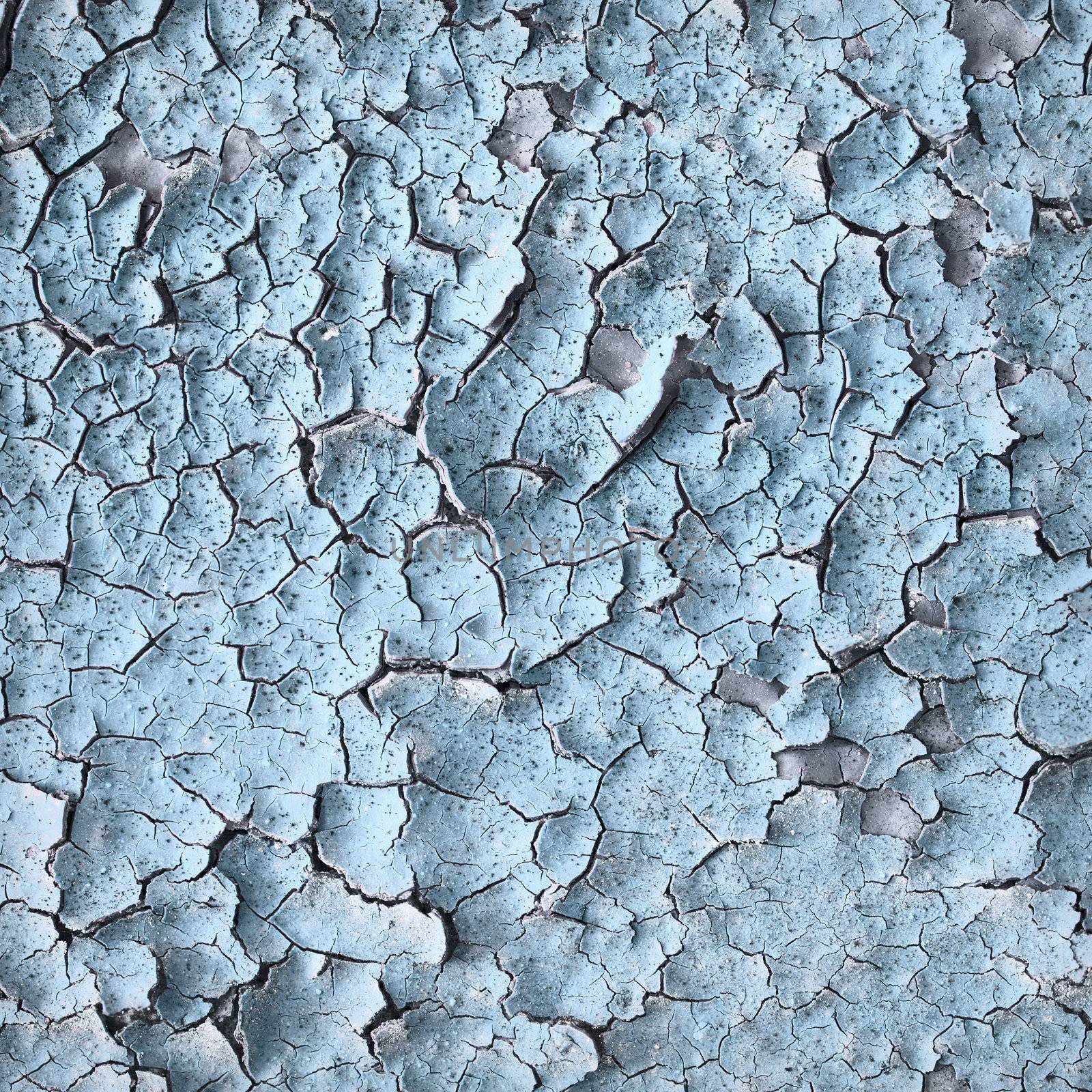 Surface of an old blue wall with cracks