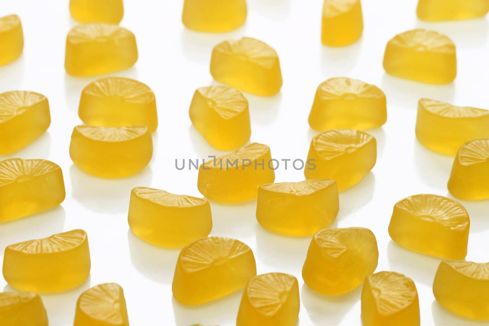 Brightly coloured wine gums on bright background