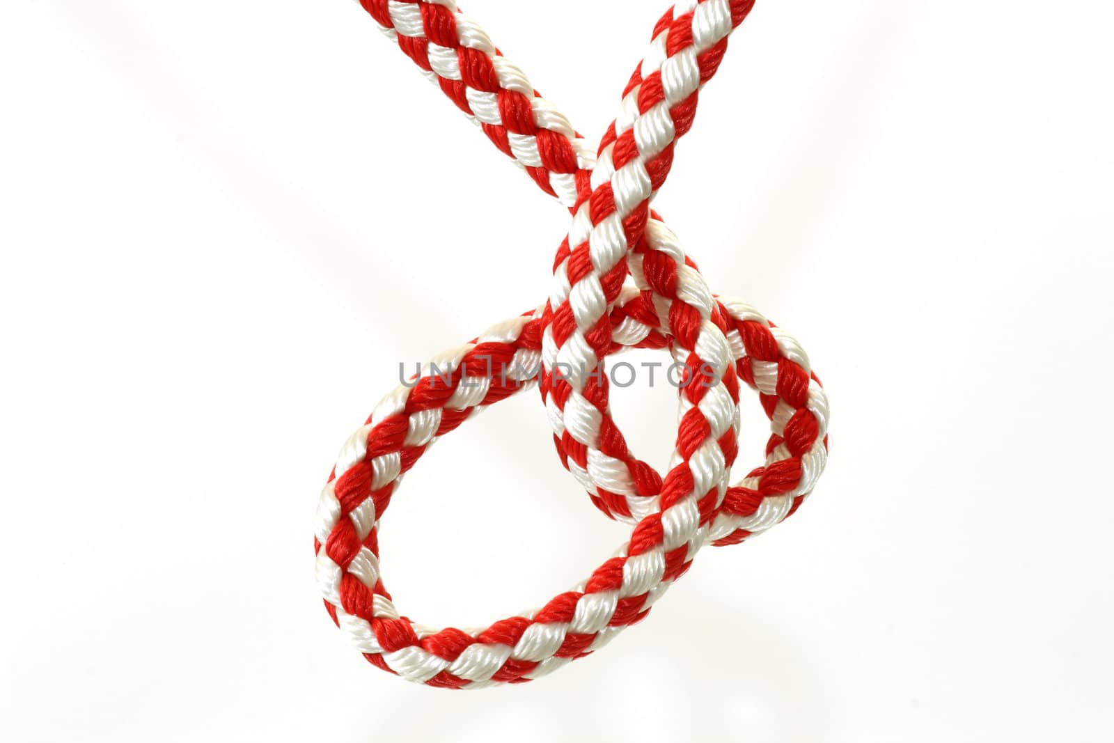 Rope with knot close up. Isolated on white background.