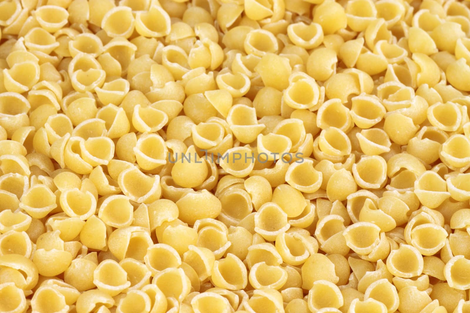 Yellow noodles close up as background