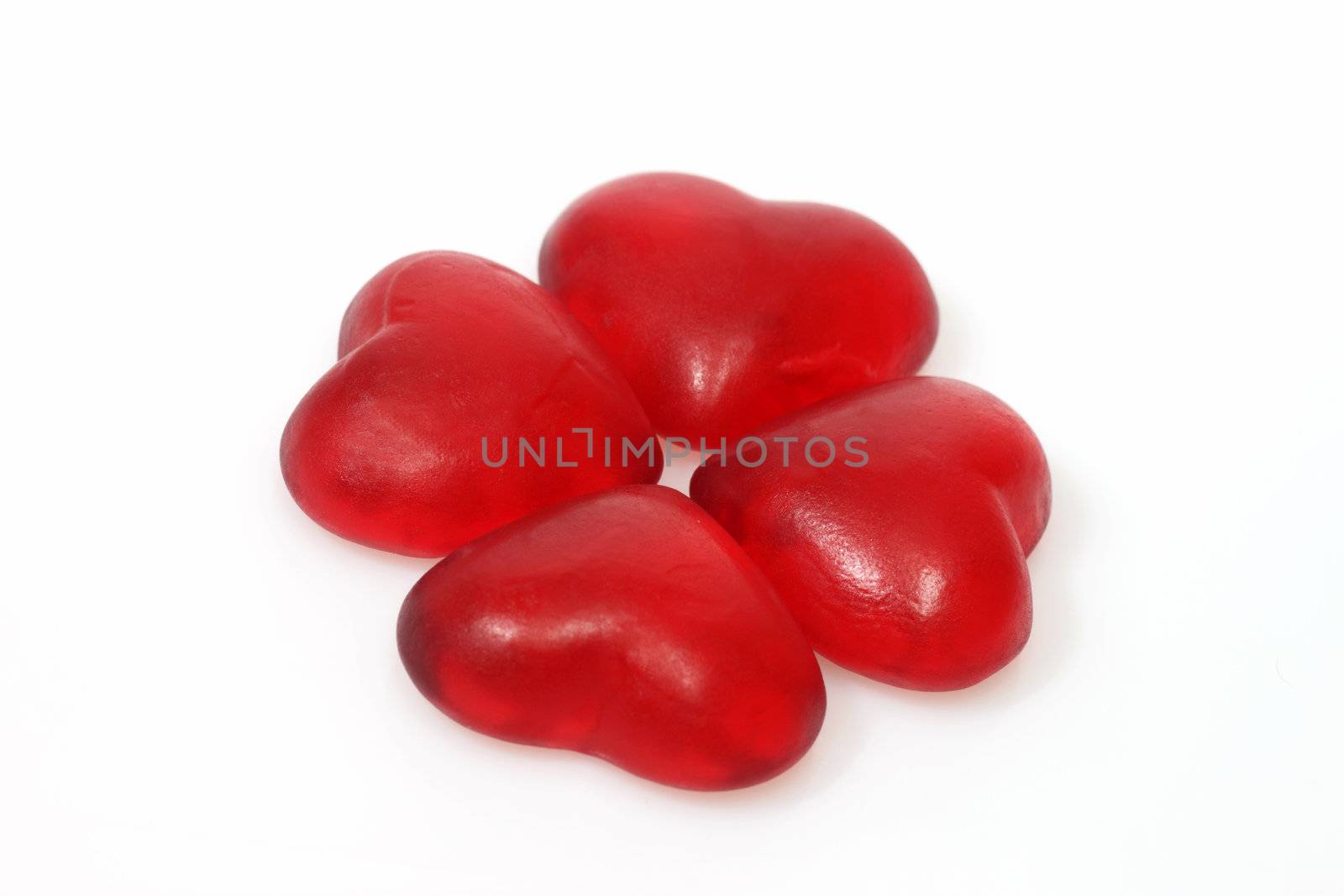 Brightly coloured wine gums on bright background