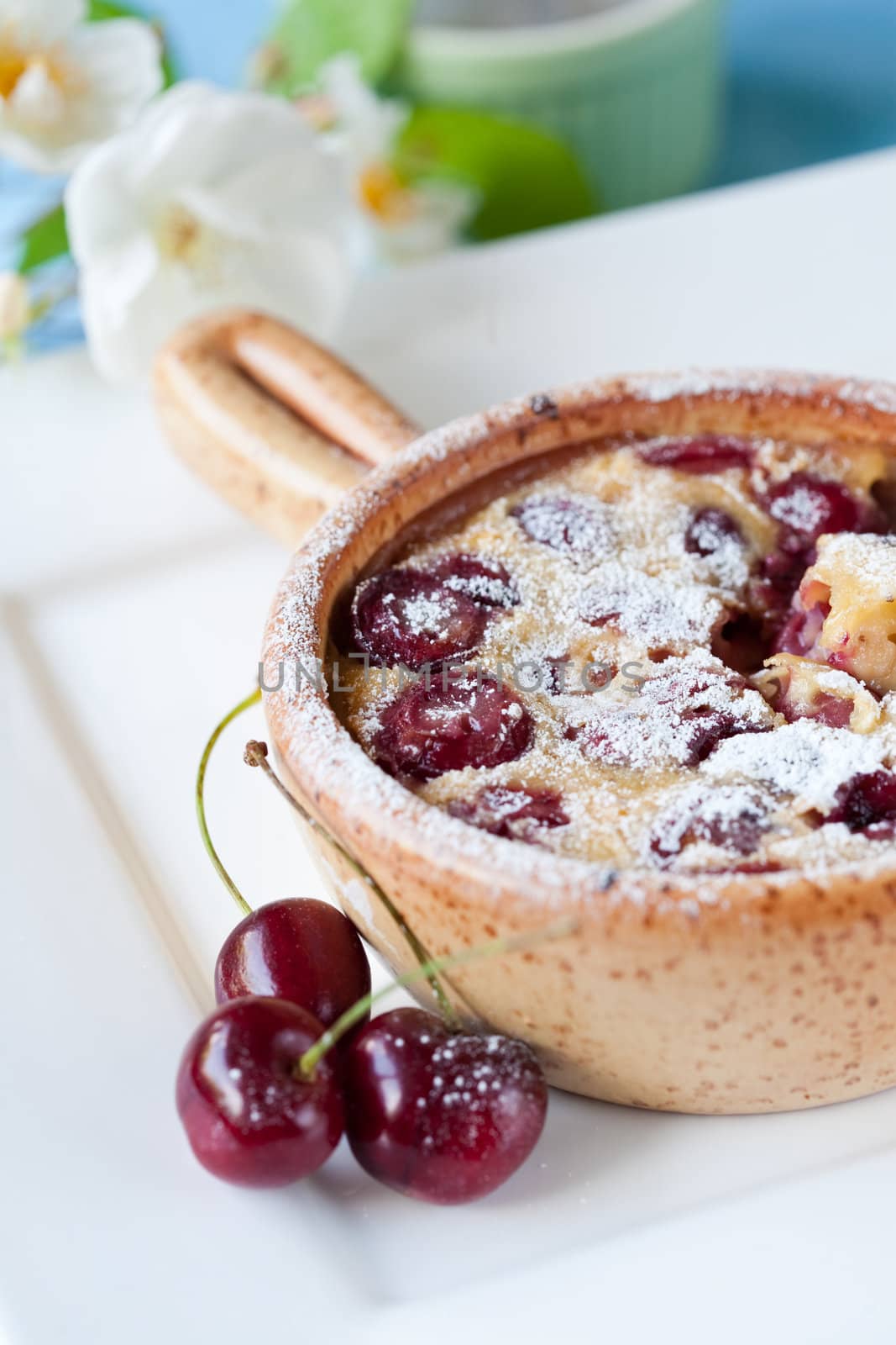 Delicious cherry clafoutis dessert with fresh cherries