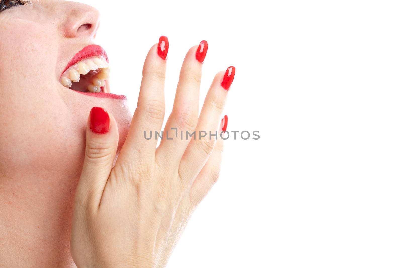 Woman laughing out loud with her hand in front of her mouth