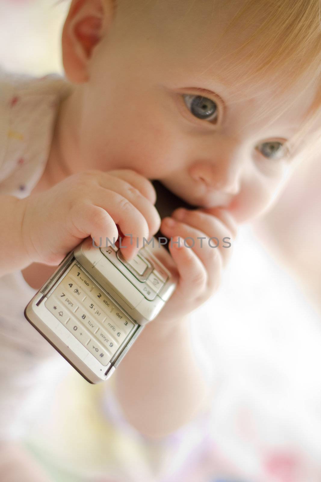 Portret of little  girl with phone