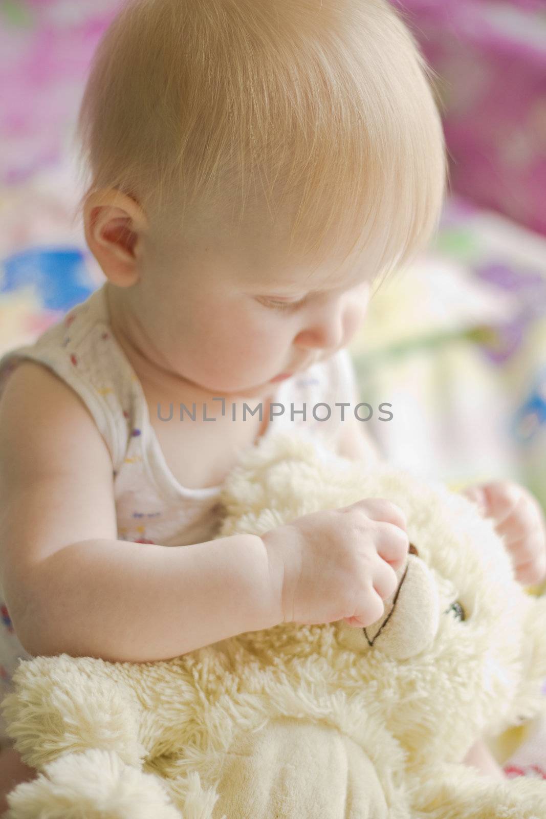 Portret of little  girl with teddy bear