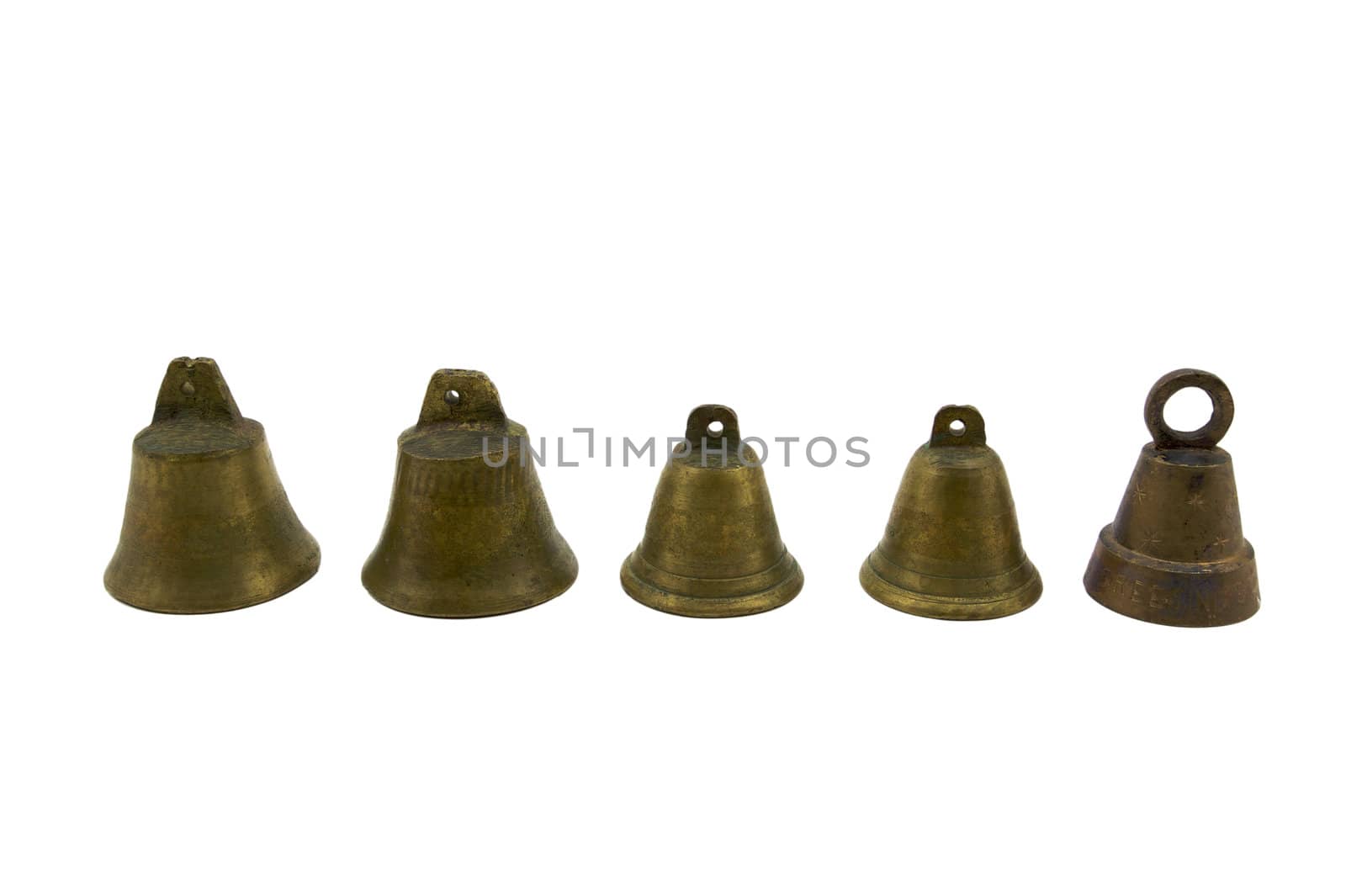 Five Small brass bells lined in a row on a white background