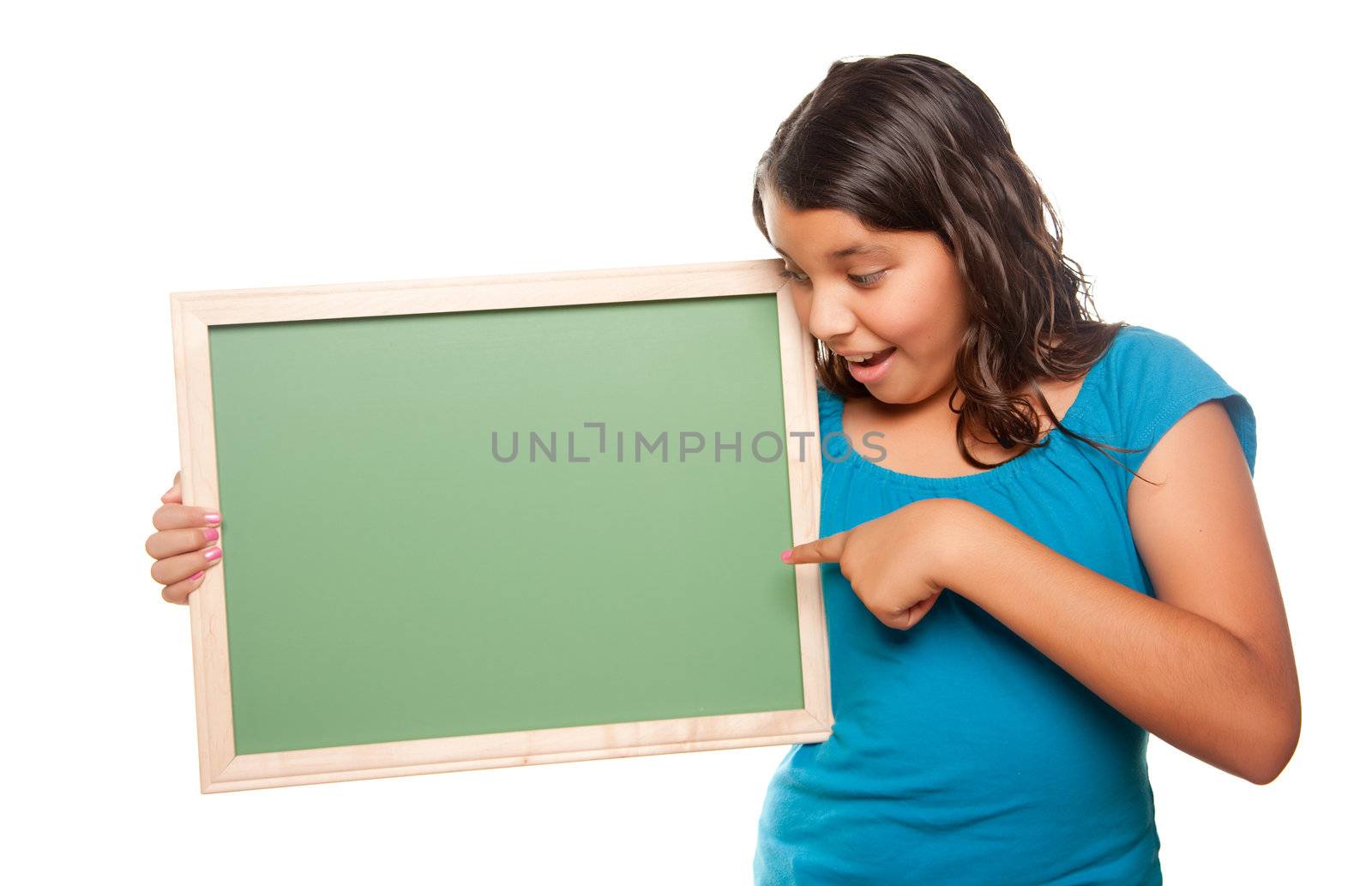 Pretty Hispanic Girl Pointing and Holding Blank Chalkboard Isolated on a White Background.