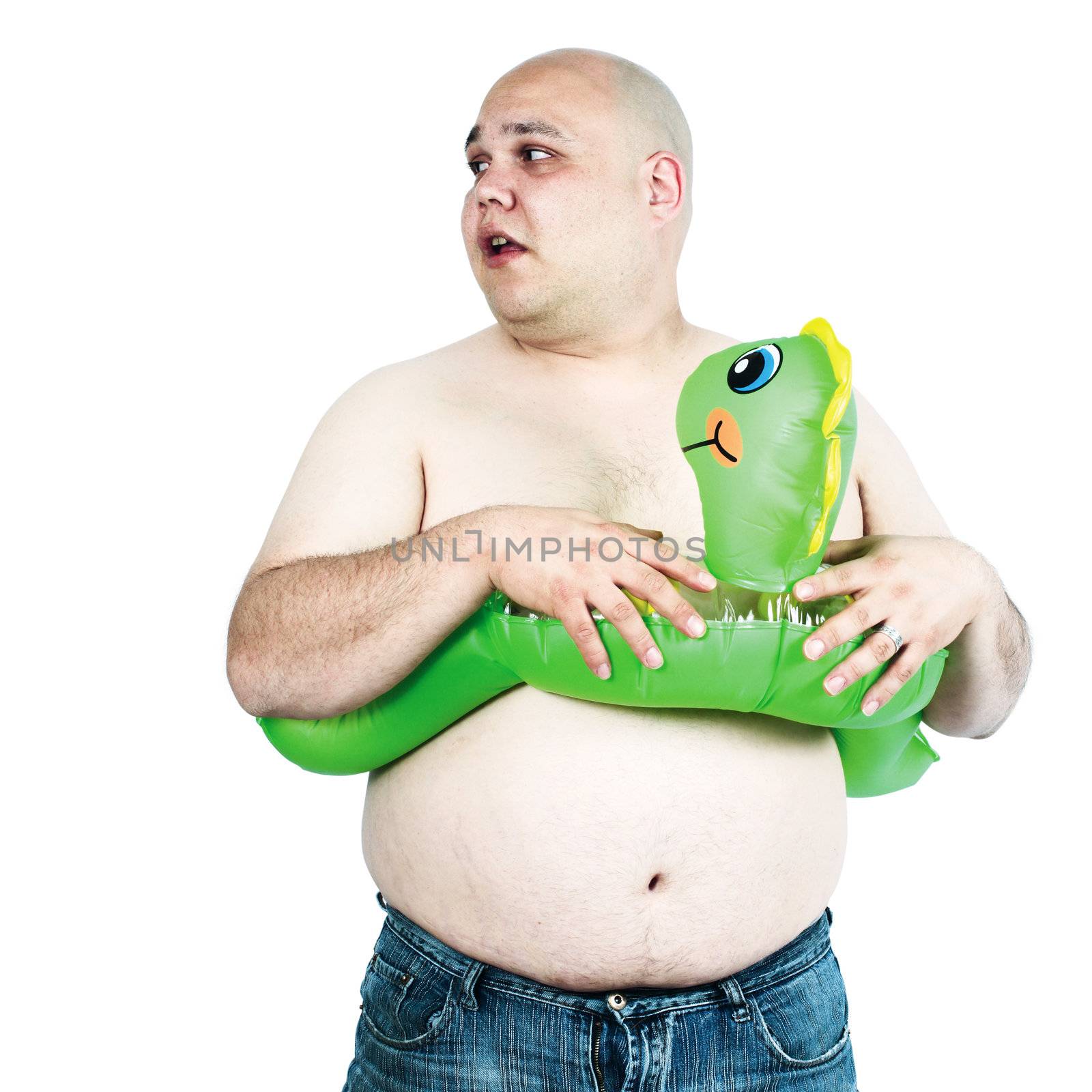 A large man with inflatable toy looks for the pool or the beach.
