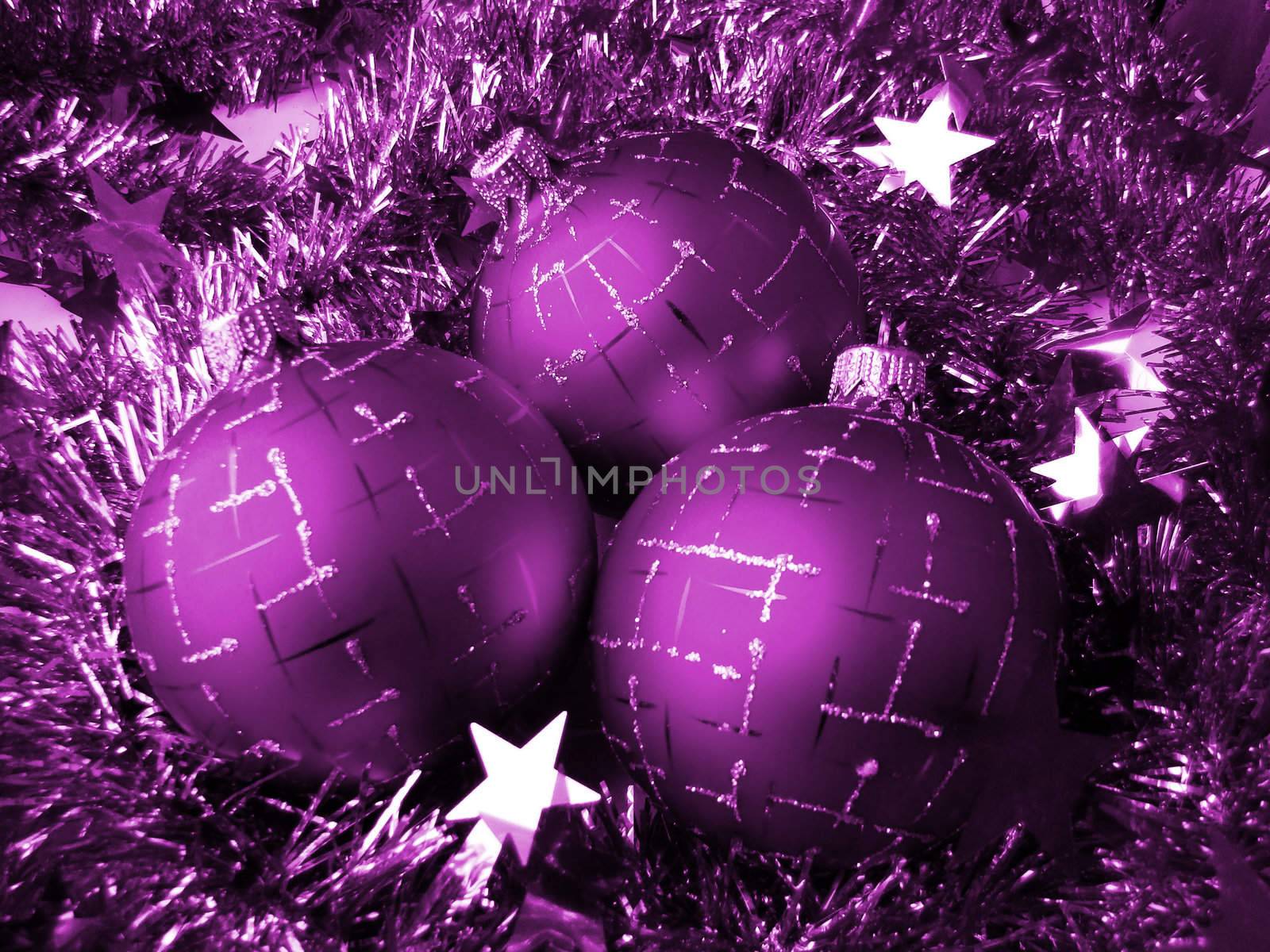 Christmas glass sphere of dark color with a pattern on a background of a celebratory tinsel                               