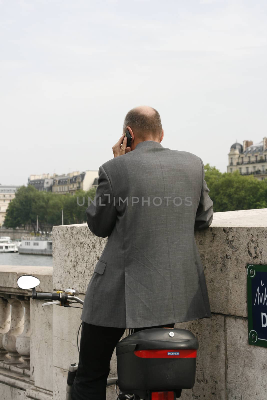 Businessman on the go in Paris France  by corot2