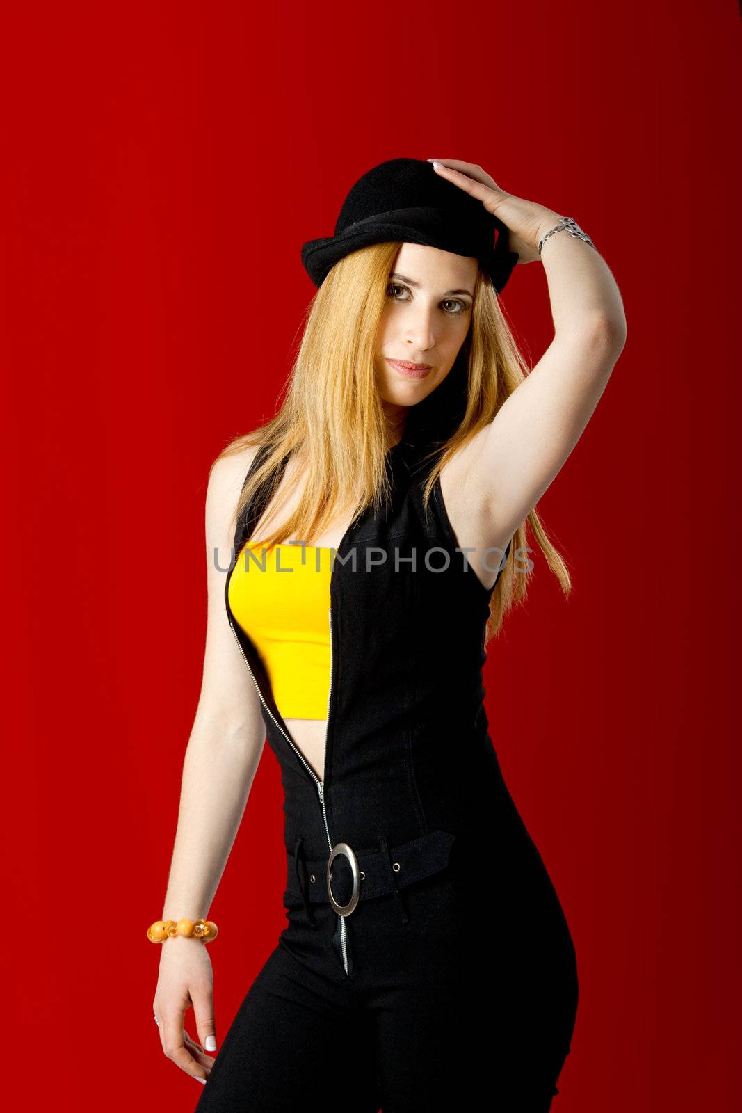 Beautiful fashion young woman over a red Background
