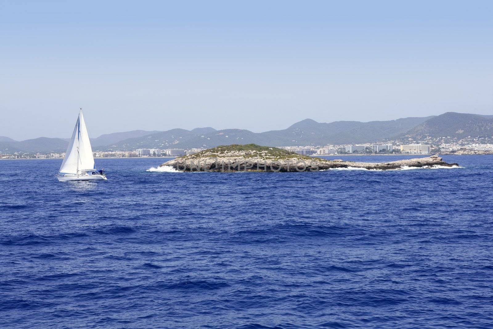 Ibiza mediterranean island blue seascape with rocks