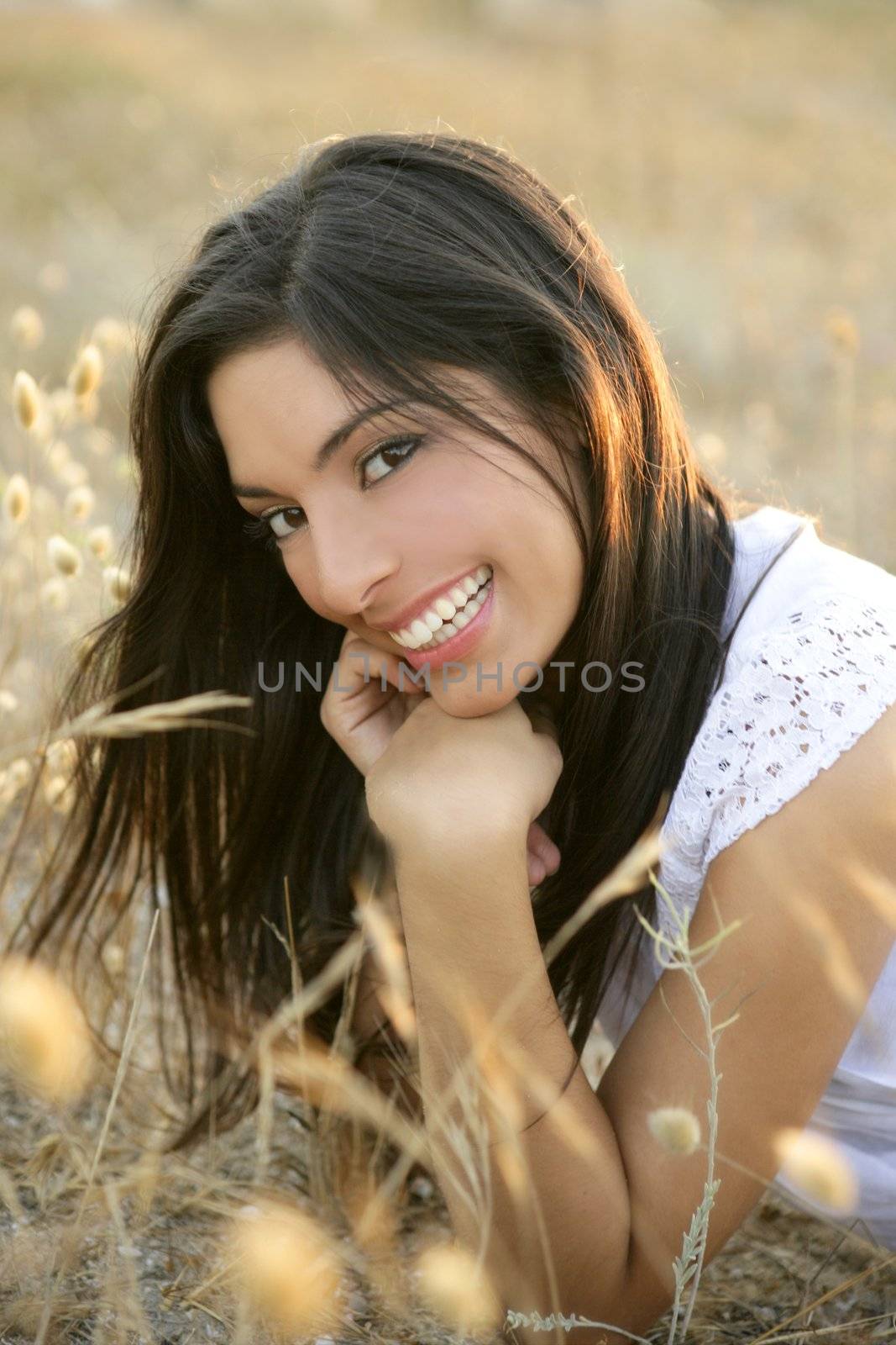 Beautiful indian brunette in a golden field by lunamarina