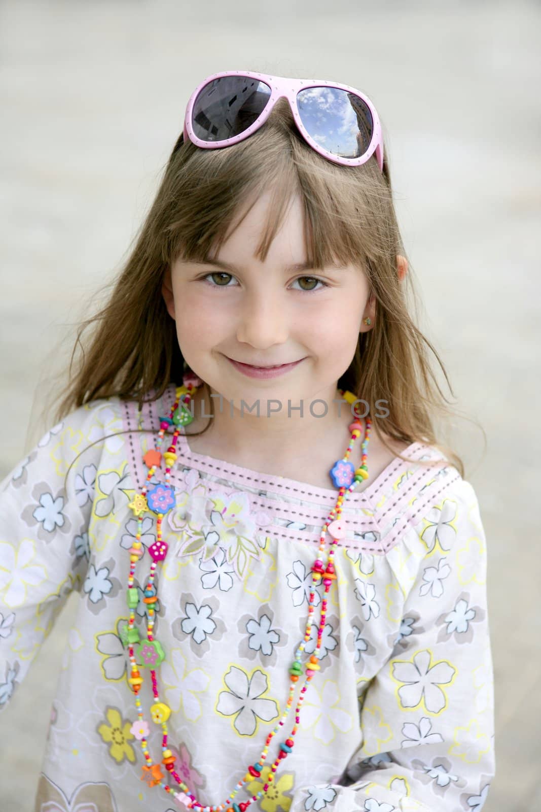 Beautiful little girl portrait in outdoors by lunamarina