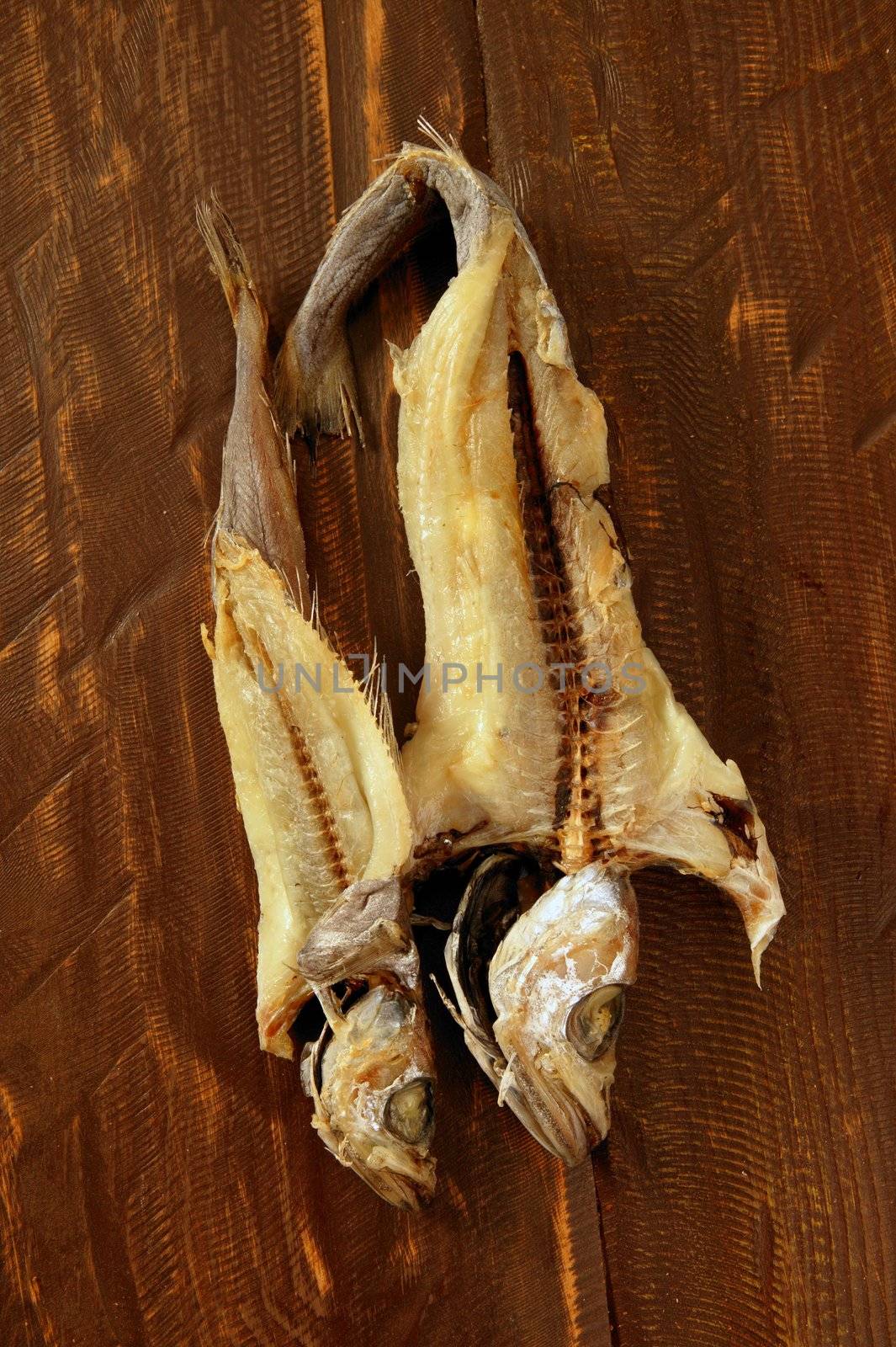 dried hake fish over wood by lunamarina