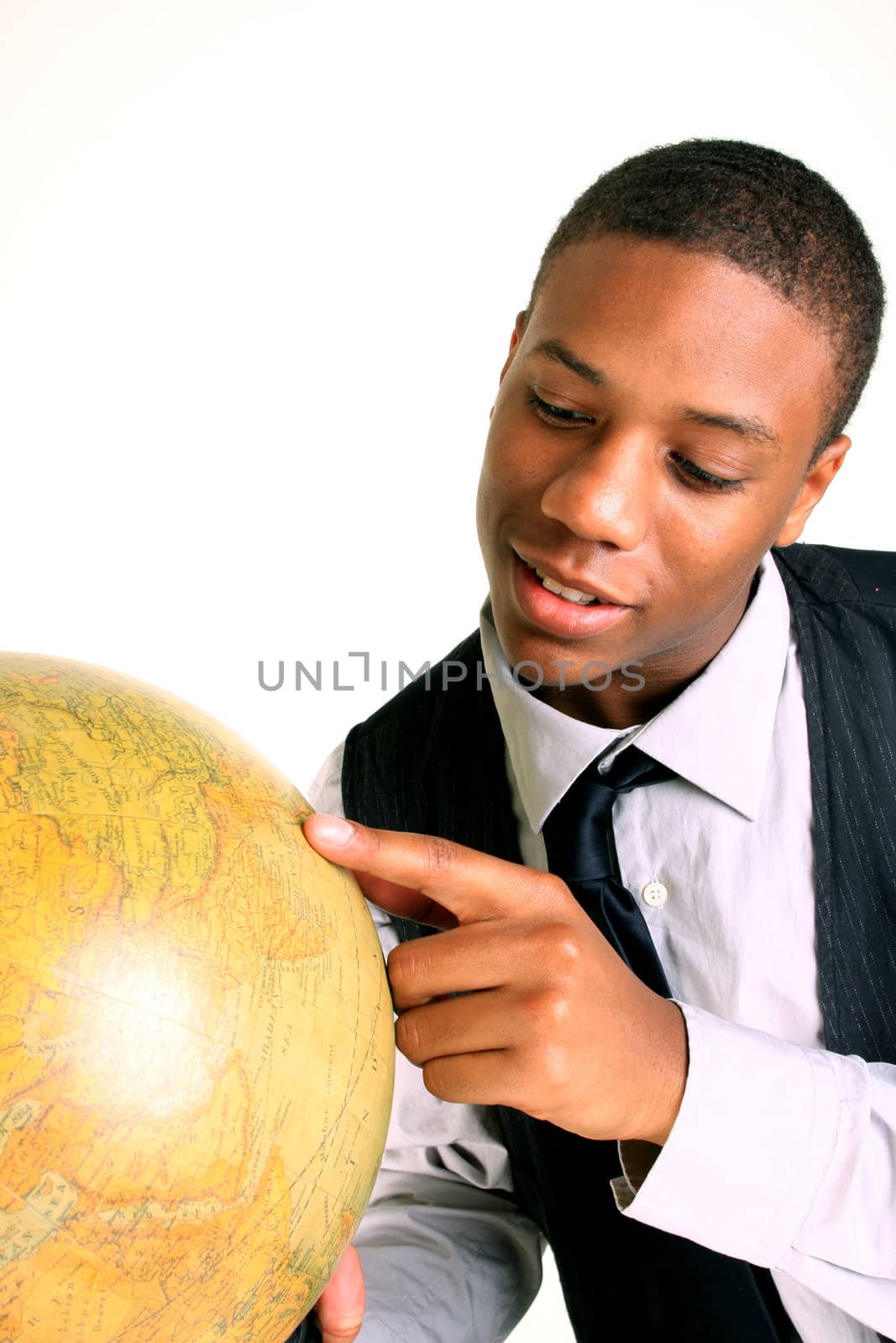 A smiling young man holding a globe