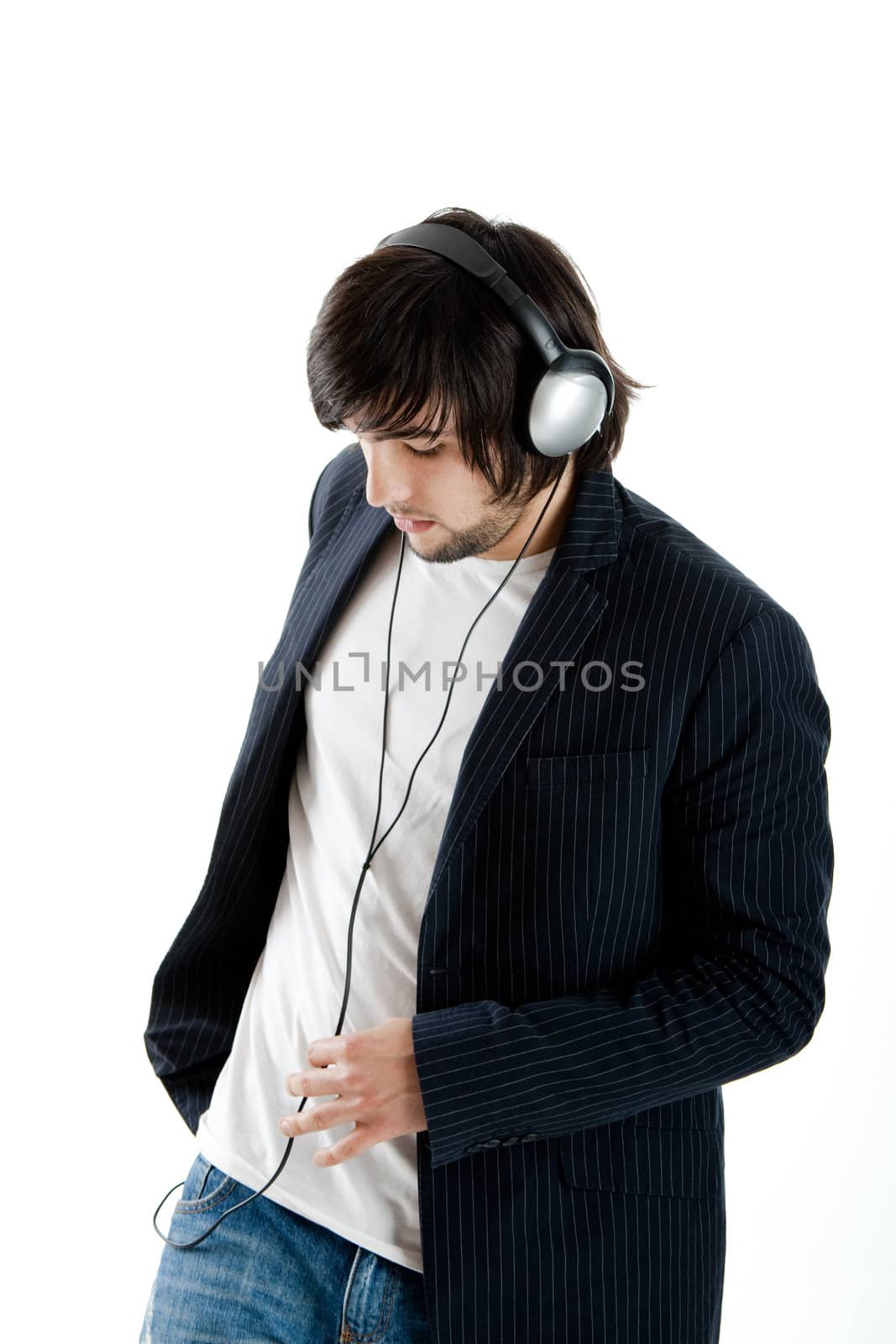 Young Man listening to music with headphones