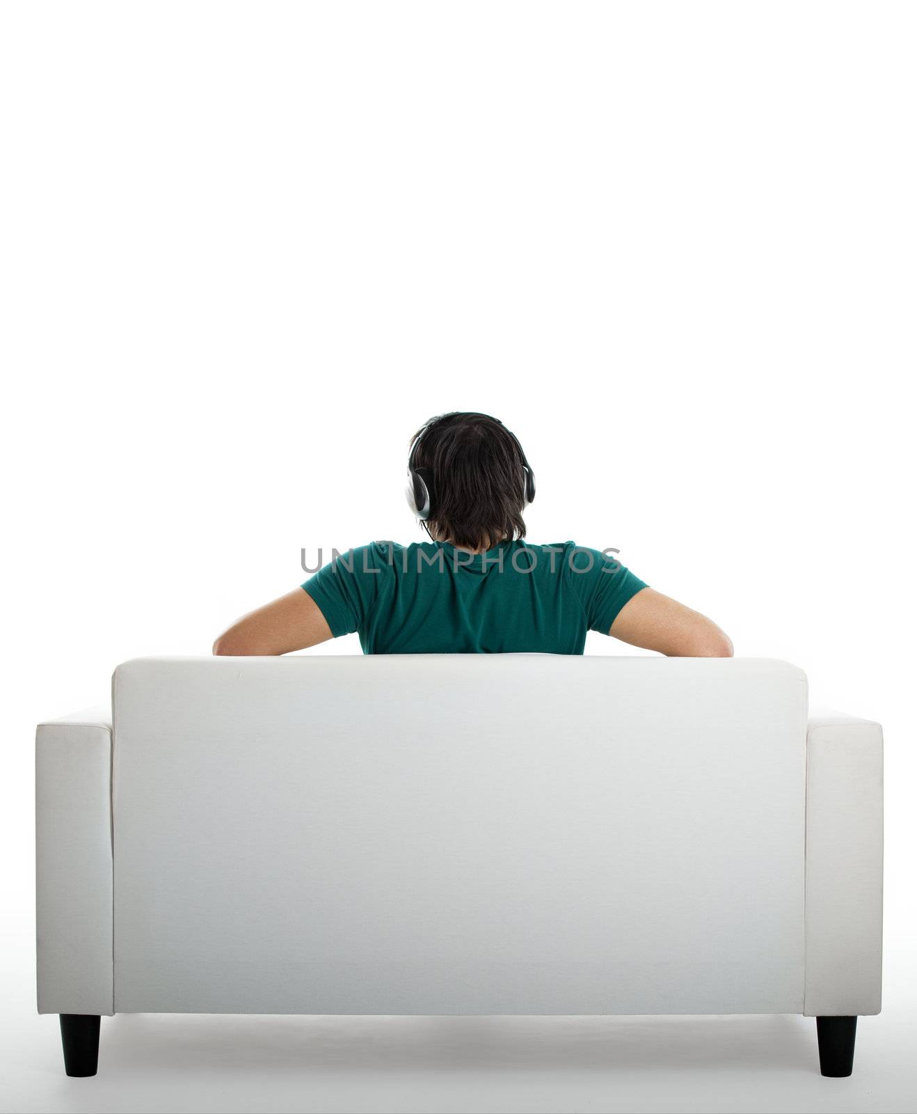 Back view from a young man seated on the couch 