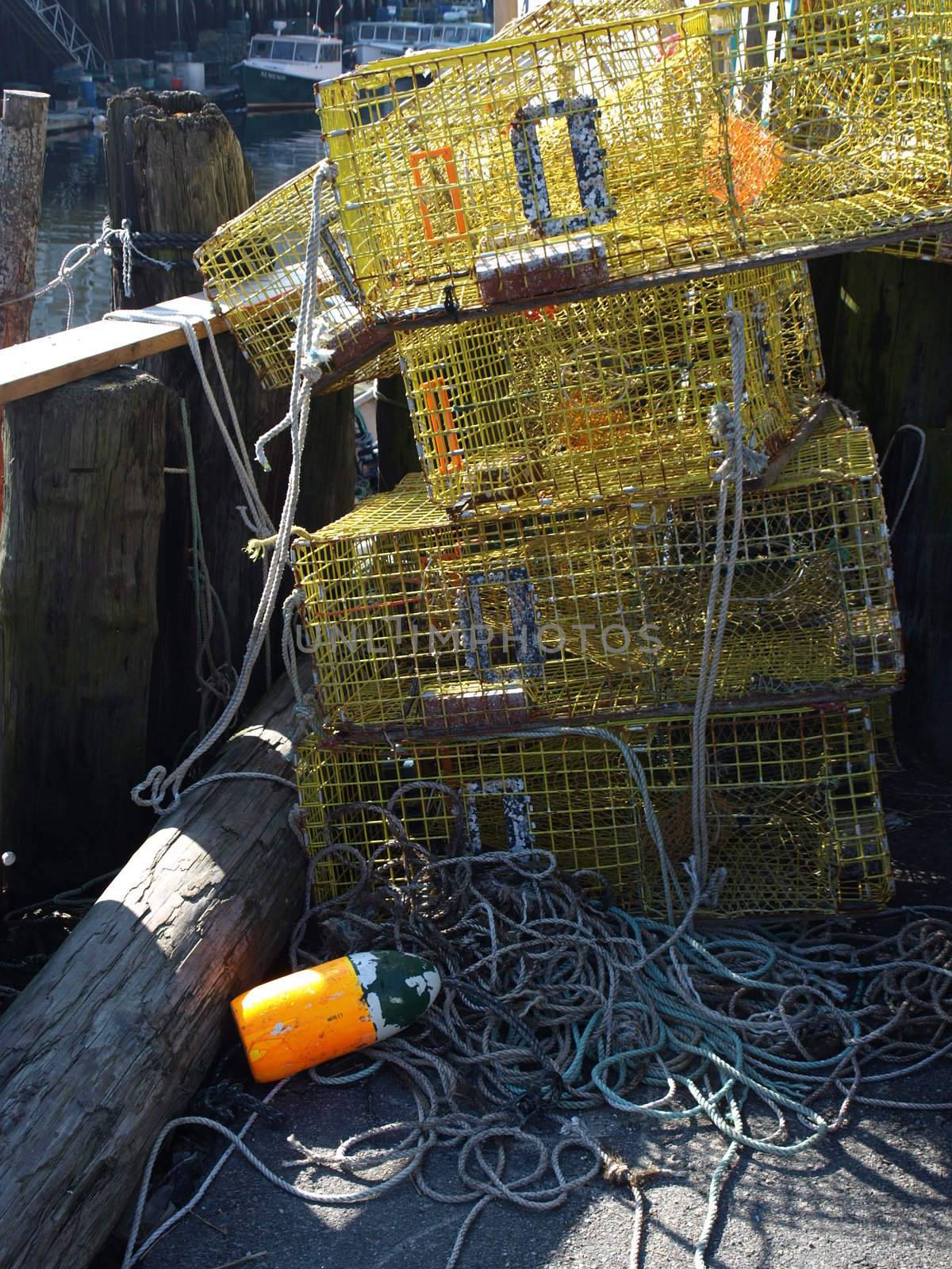 A working lobster boat along the dock in Portland, Maine during the summer with traps ready to load