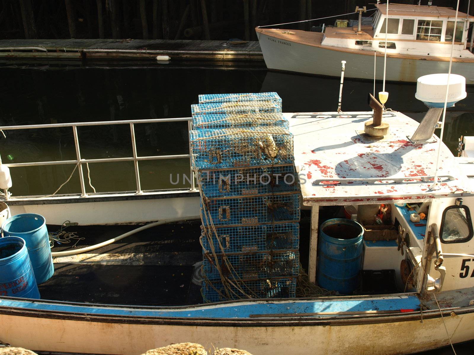 A working lobster boat along the dock in Portland, Maine during the summer