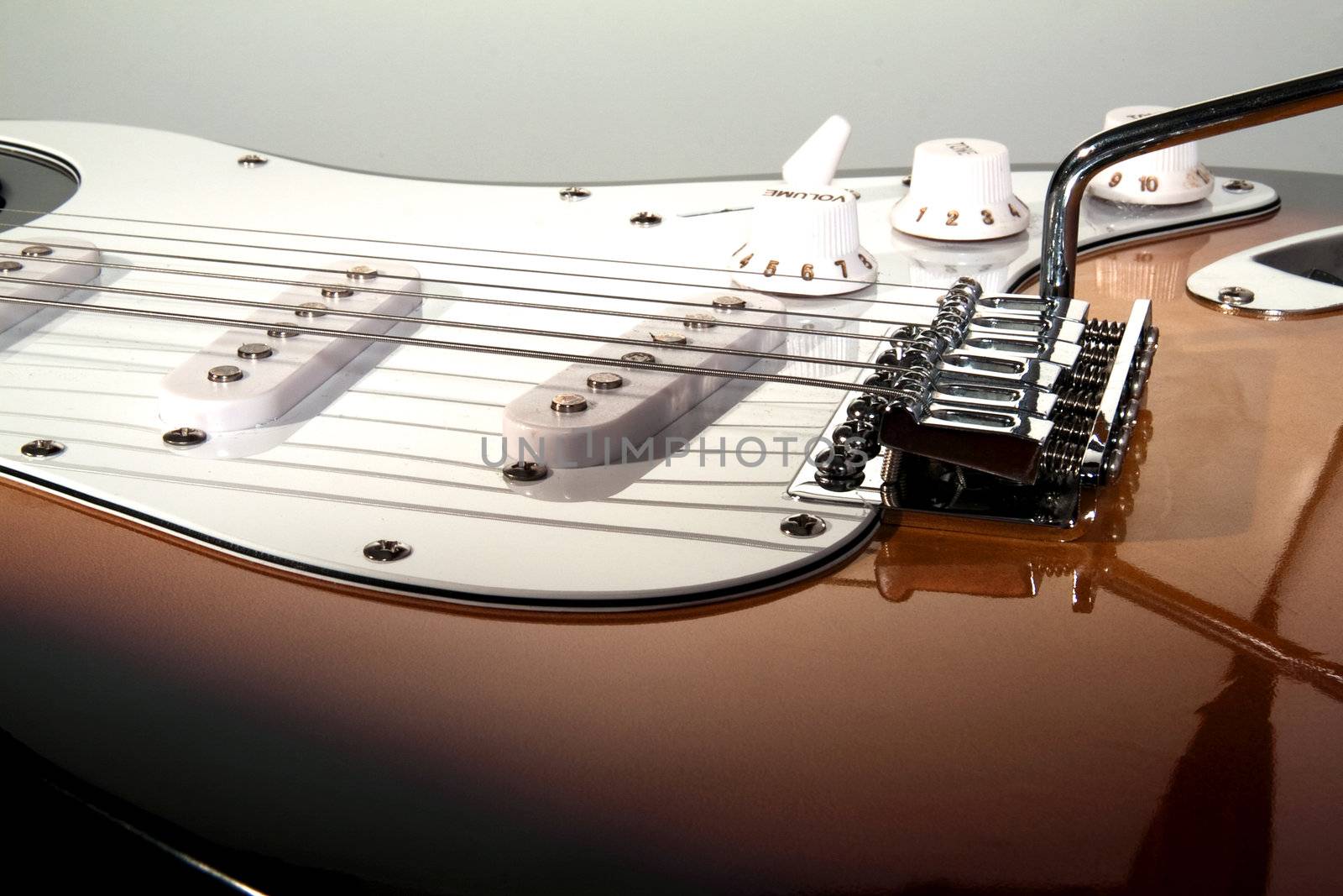 Black and white close up of neck of guitar