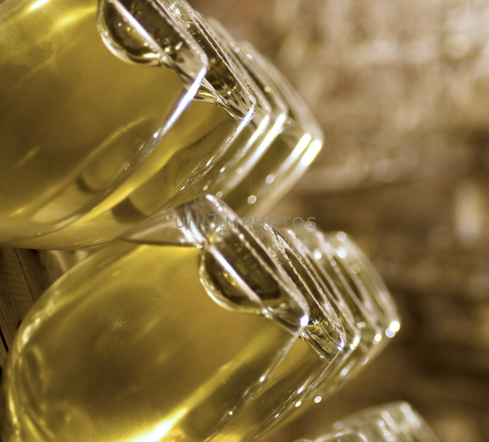 Closeup of bottles of wine aging in an old cellar