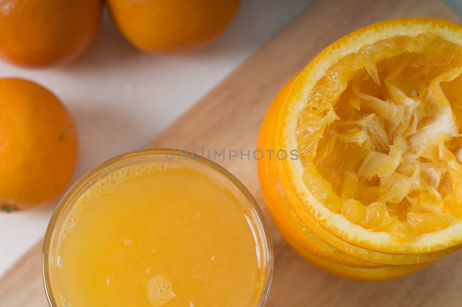 Shot of glass orang juice on the tabletop