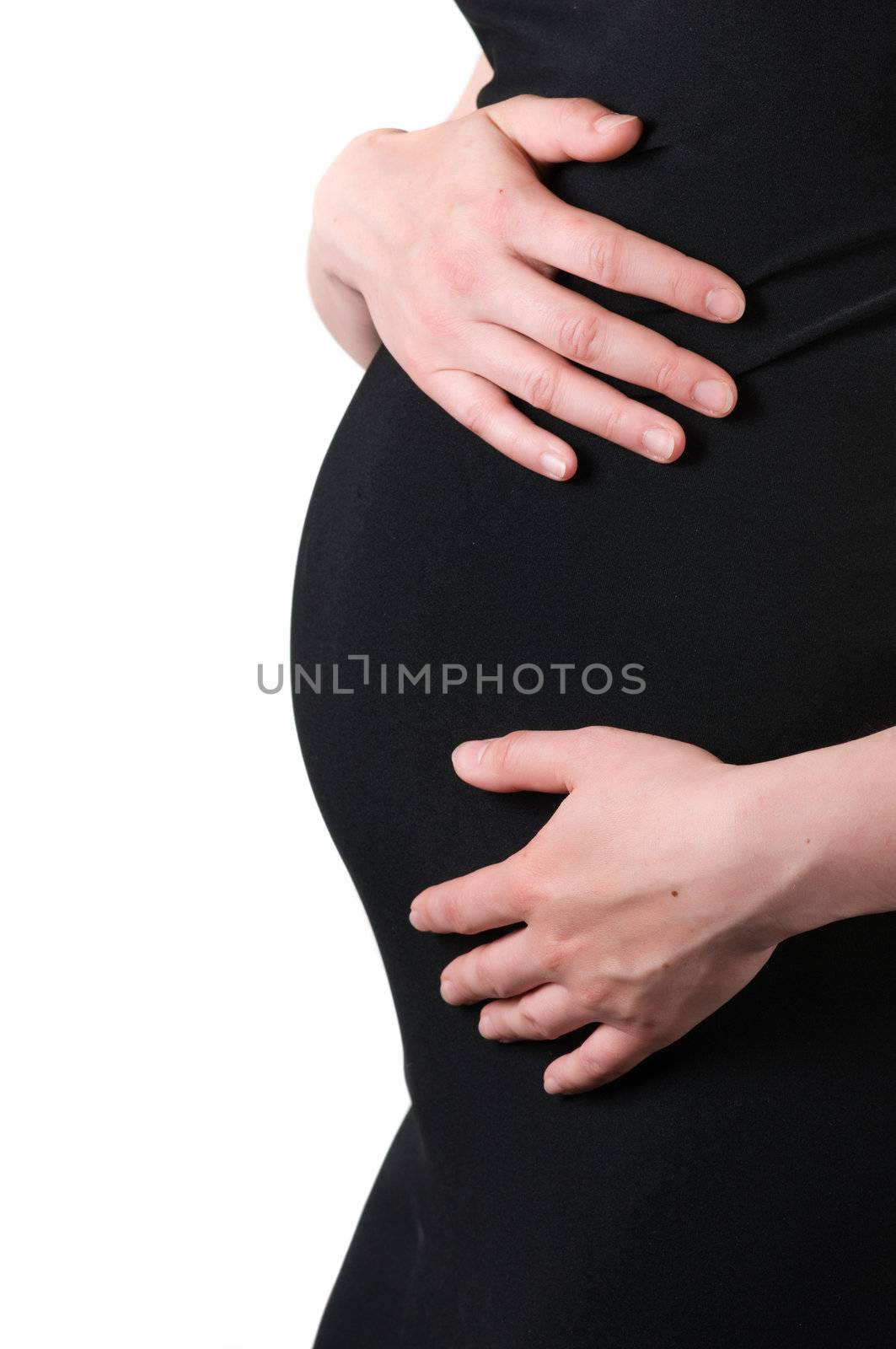 Shot of tummy pregnant woman isolated on white
