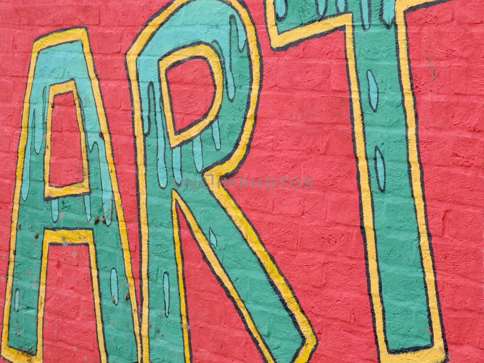 Colourful graffiti tag on a wall background spelling out the word ART