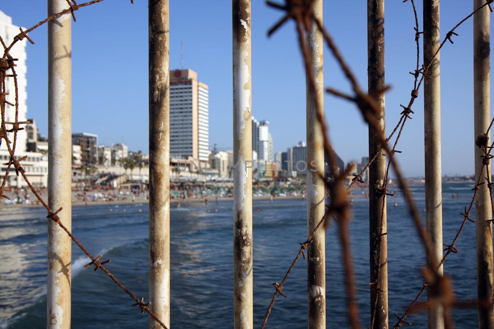 Tel Aviv city beach behind bars and iron 