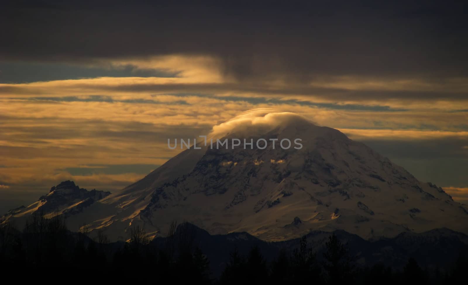 Sunrise on Mt. Rainier over the skies of Washington State.
