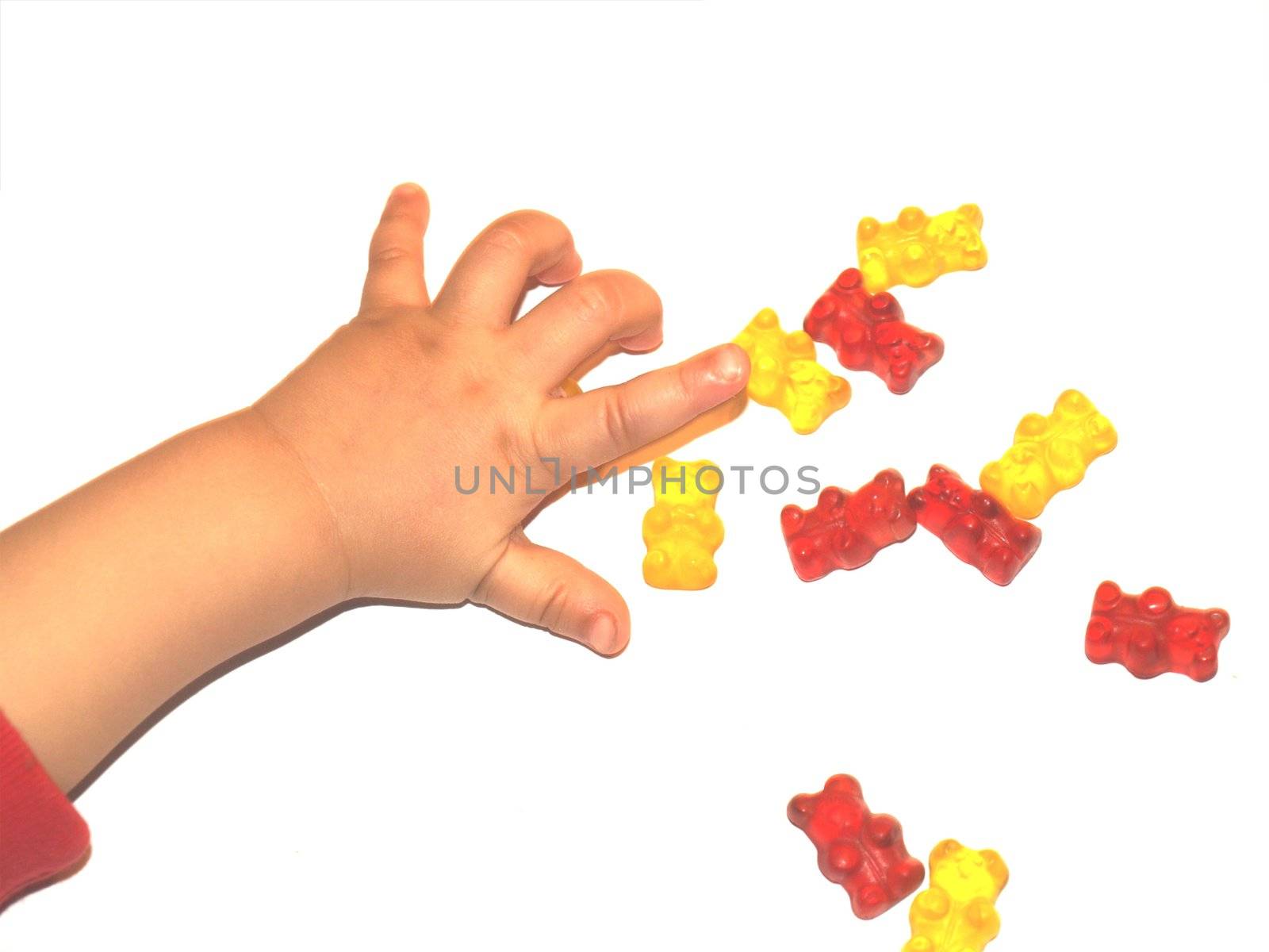 babys hand taking candy