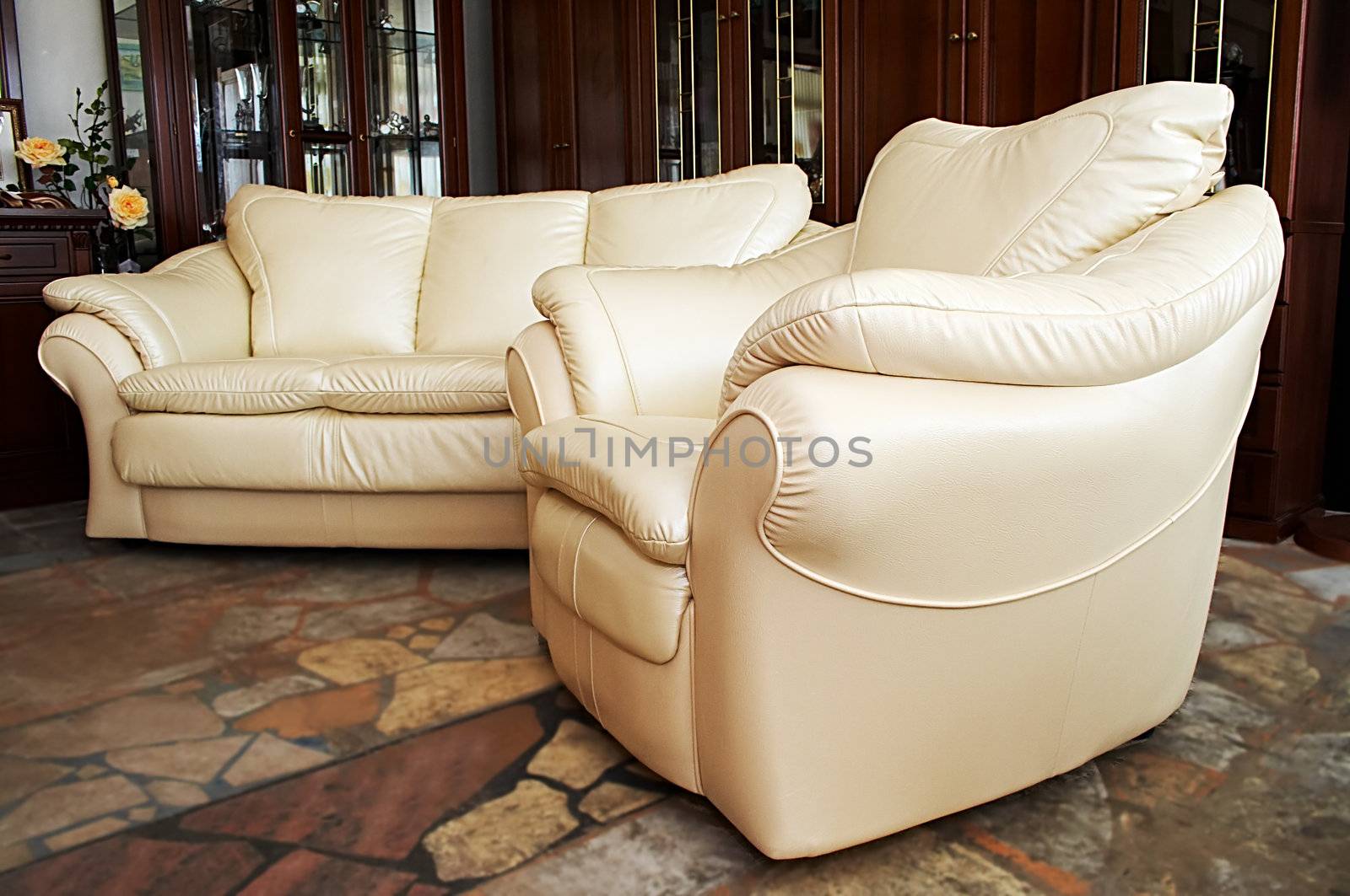 White sofa and armchair on marble to a floor